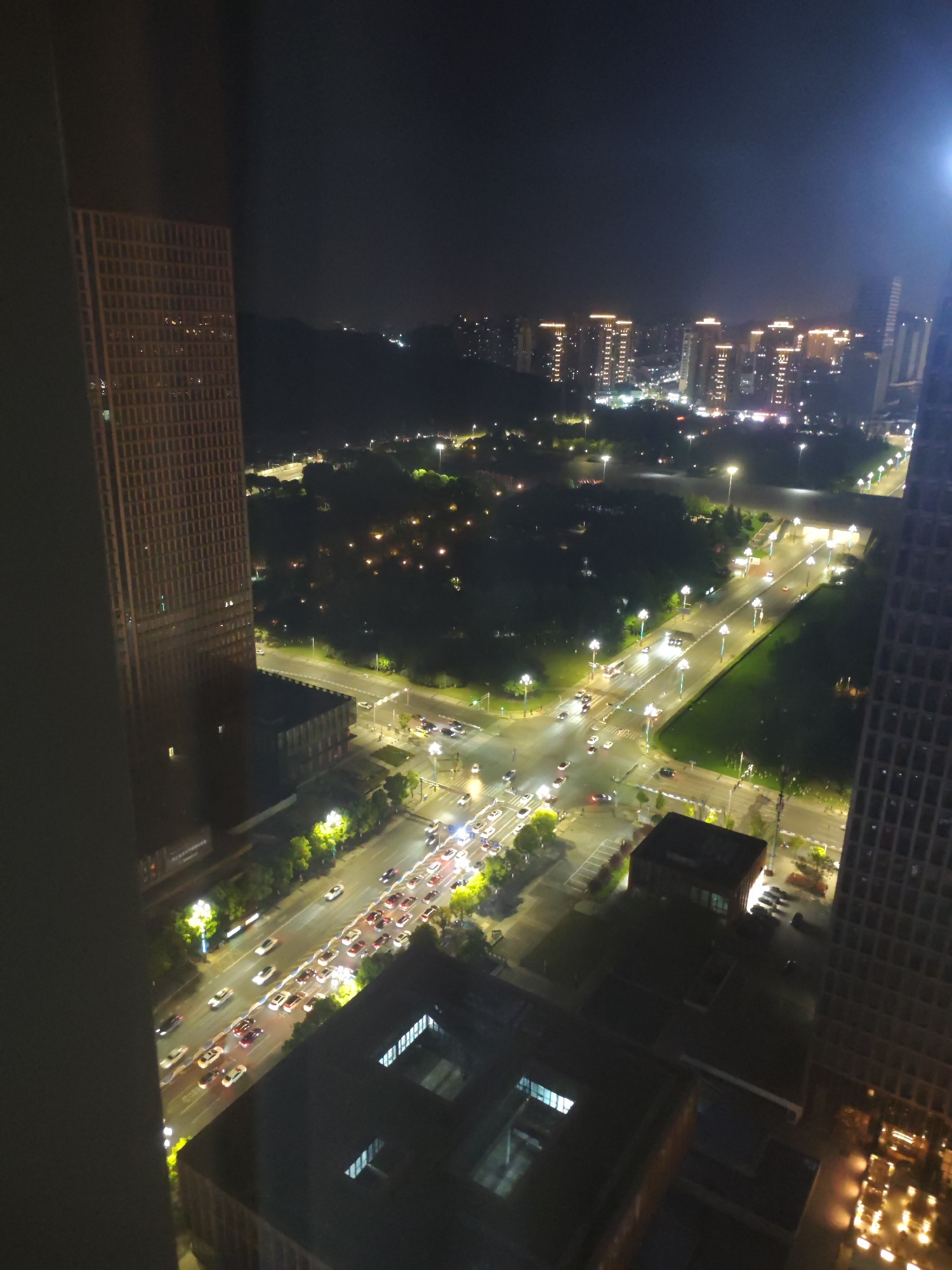 Nighttime city view captured from high vantage point in Liangjiang