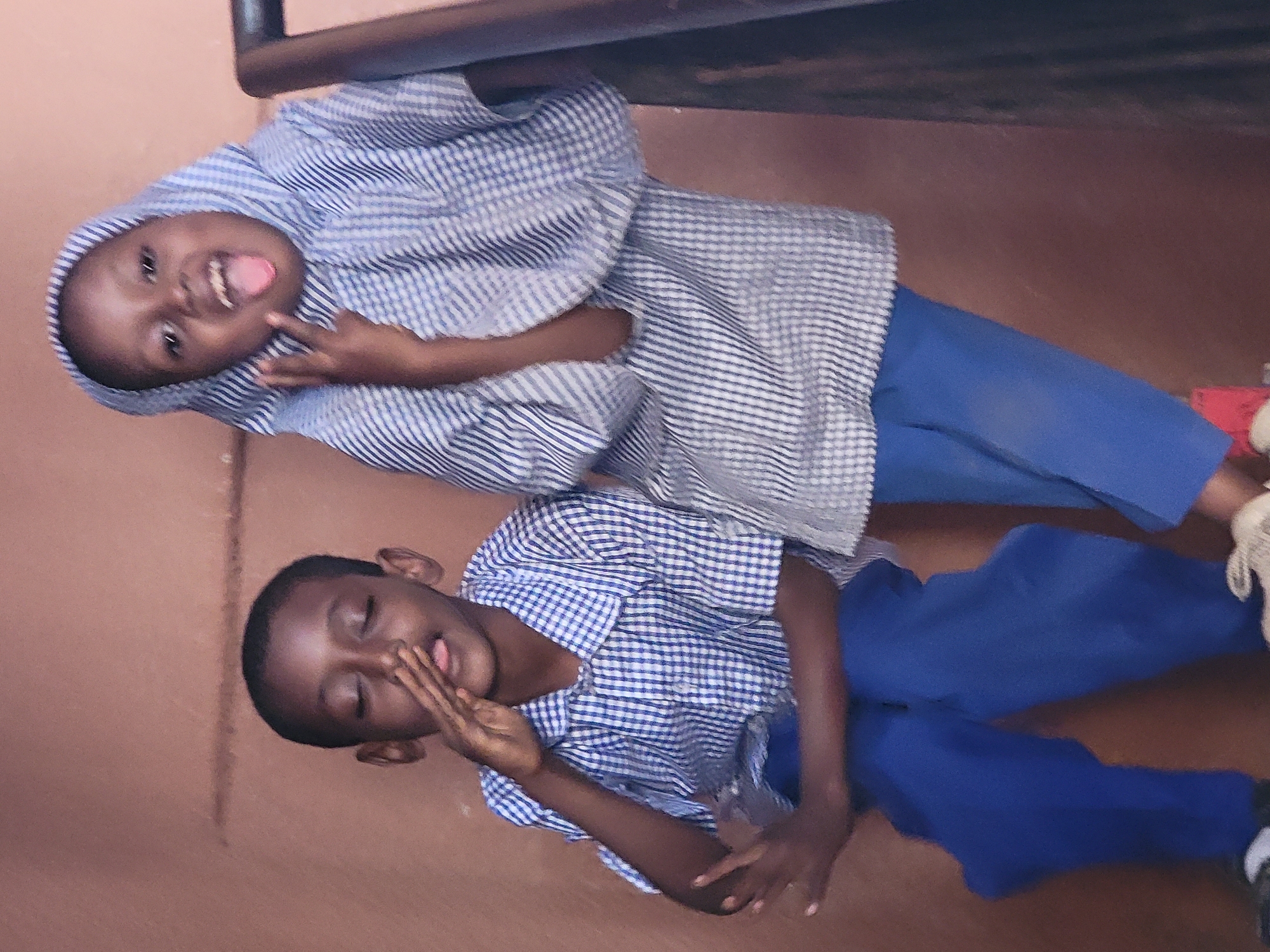 Children and adult photographed in casual gathering, Maiburiji Nigeria