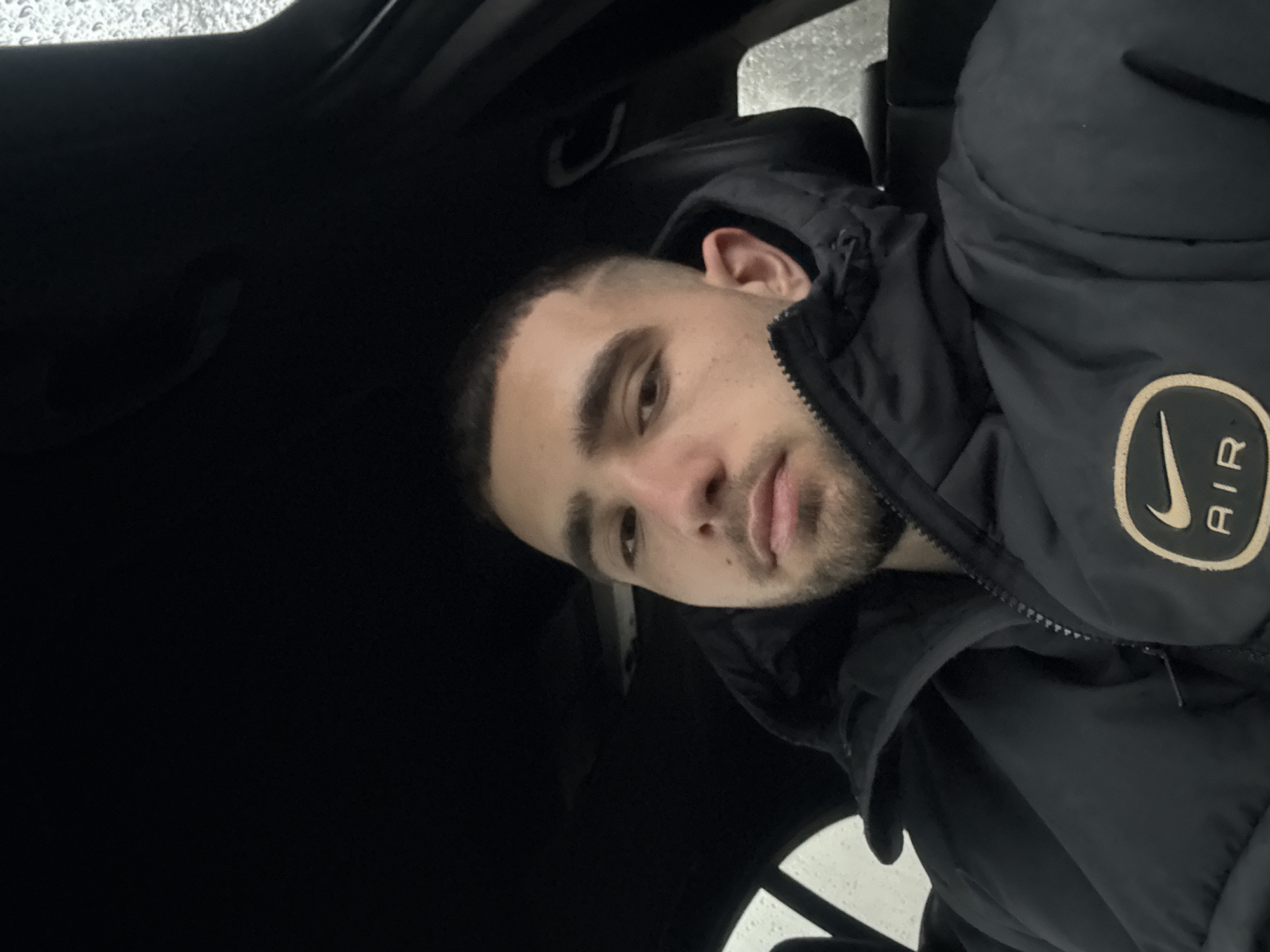Man takes early morning car selfie in Bulgarian village