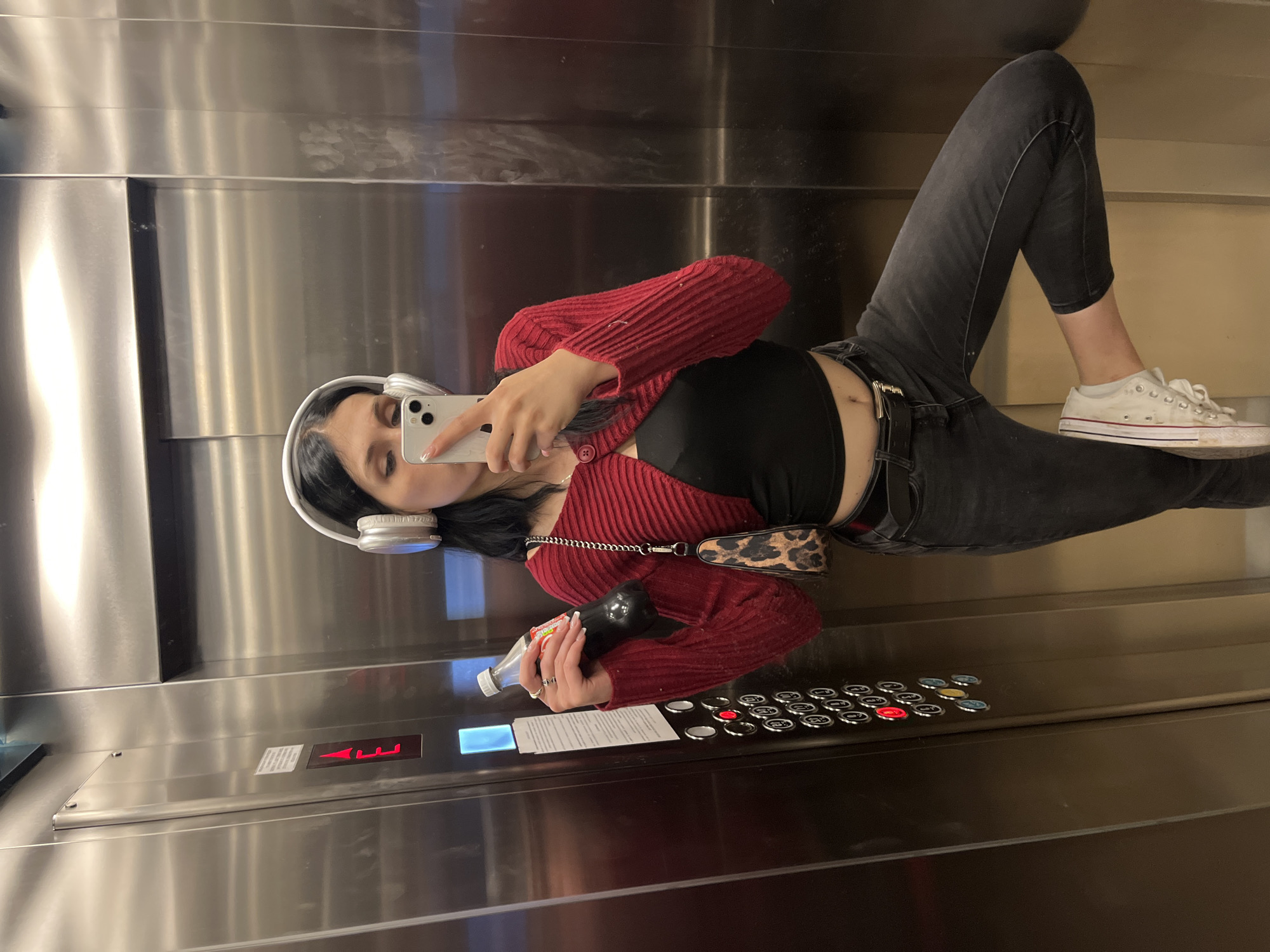 Elevator selfie with red sweater and headphones