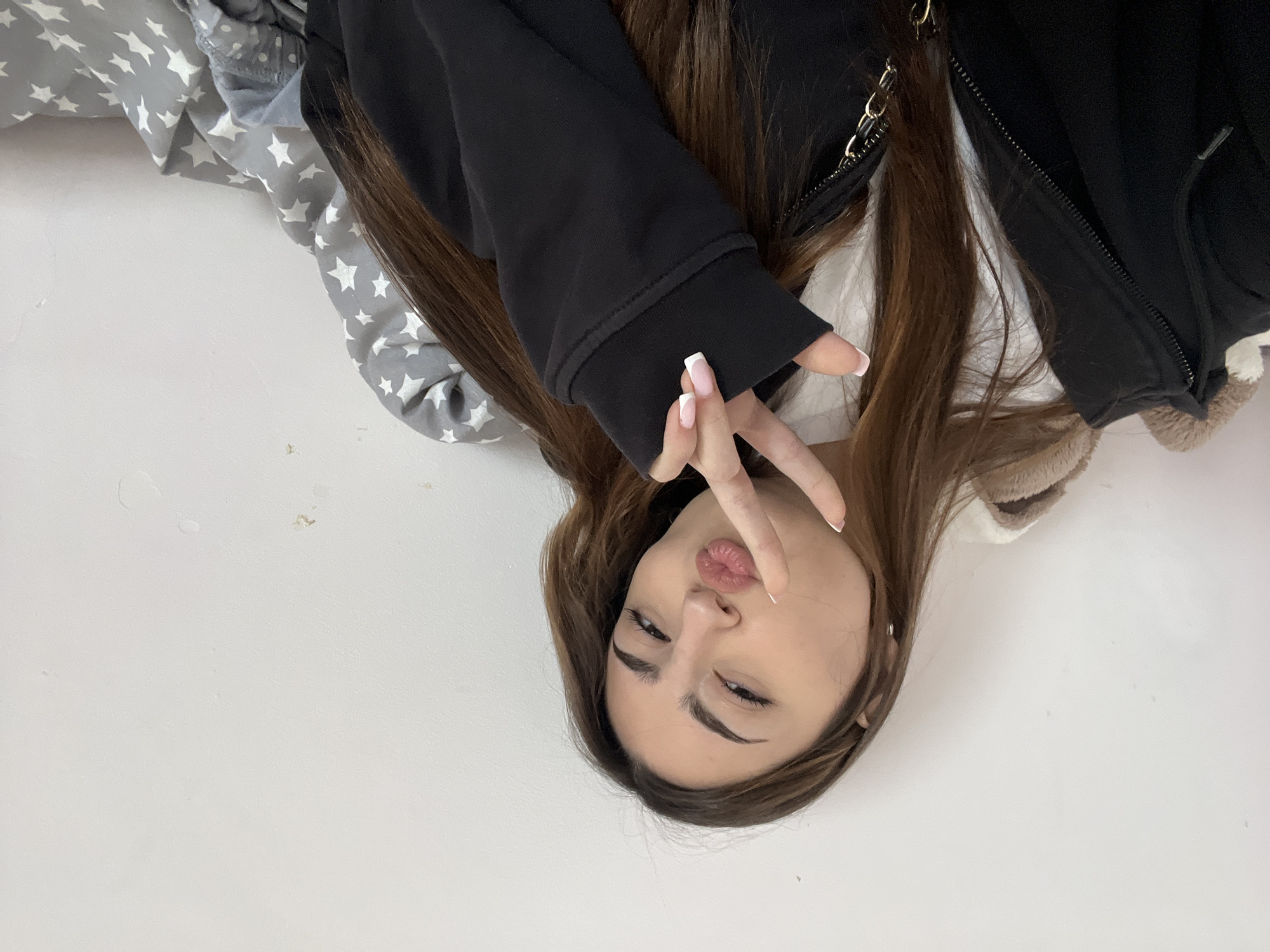 Woman takes morning selfie with peace sign in Yerevan