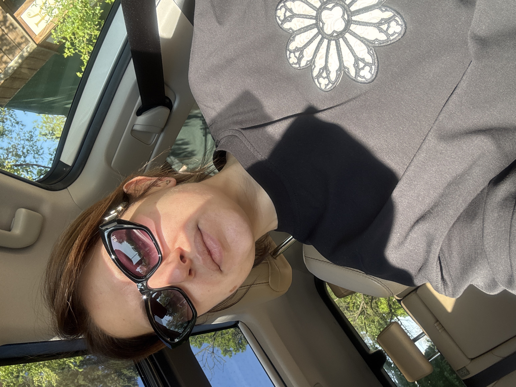 Woman photographed as car passenger on sunny Sofia morning