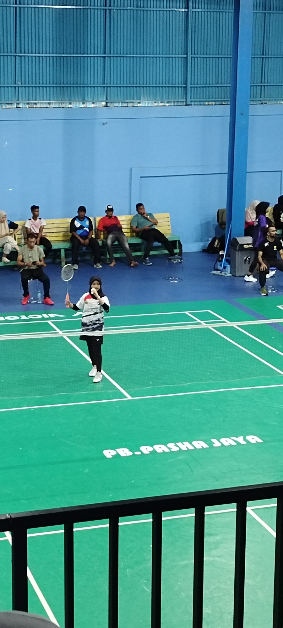 Badminton match underway at an indoor court in Banda Aceh