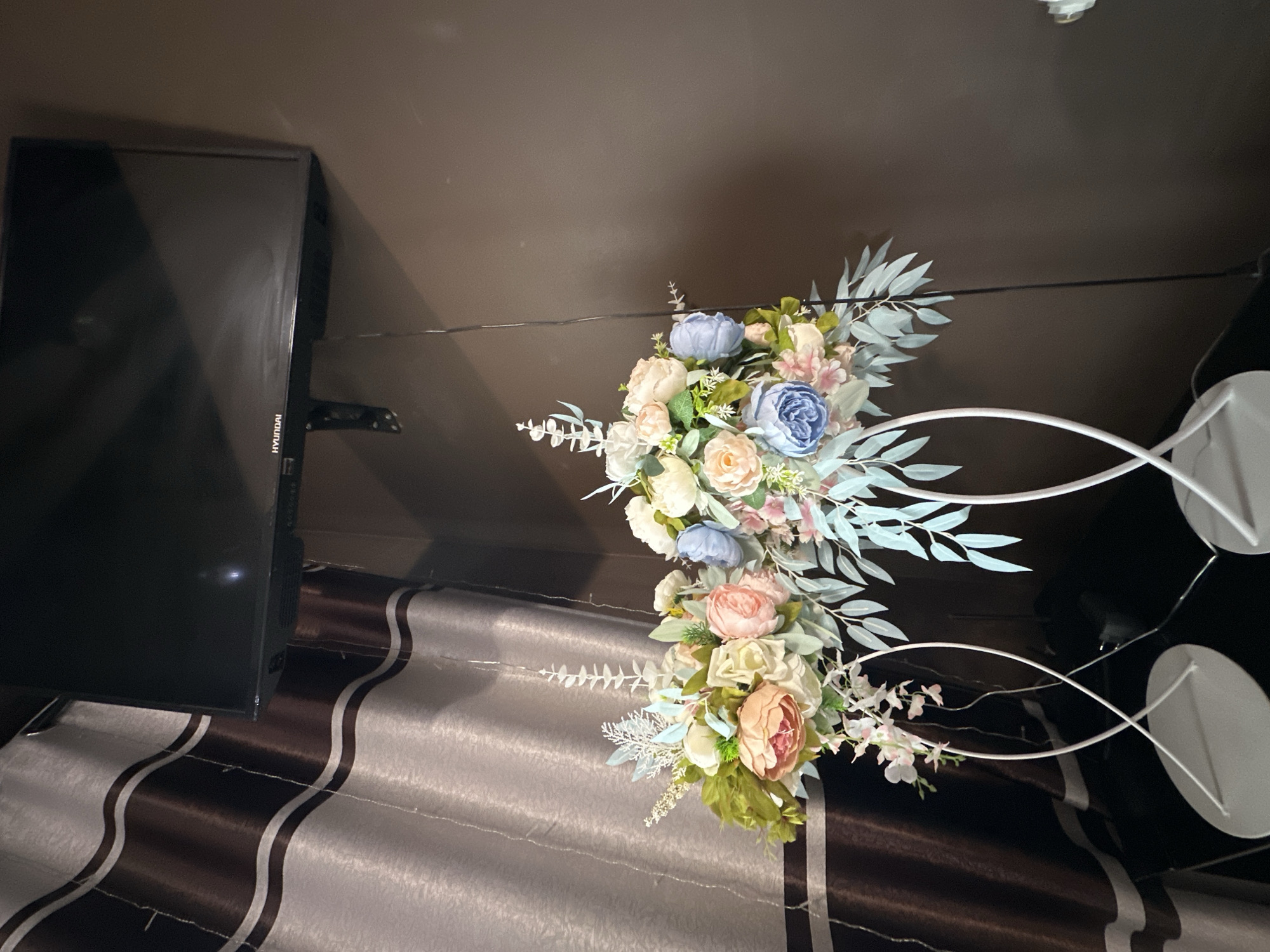 Wedding reception documented with floral arrangements and fairy lights