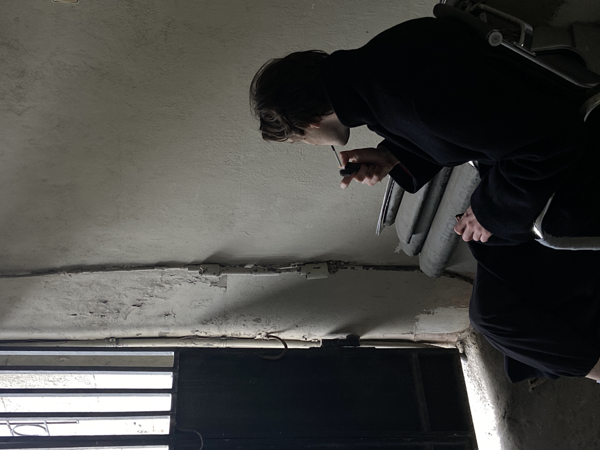 Person investigates underground office area in Moscow building
