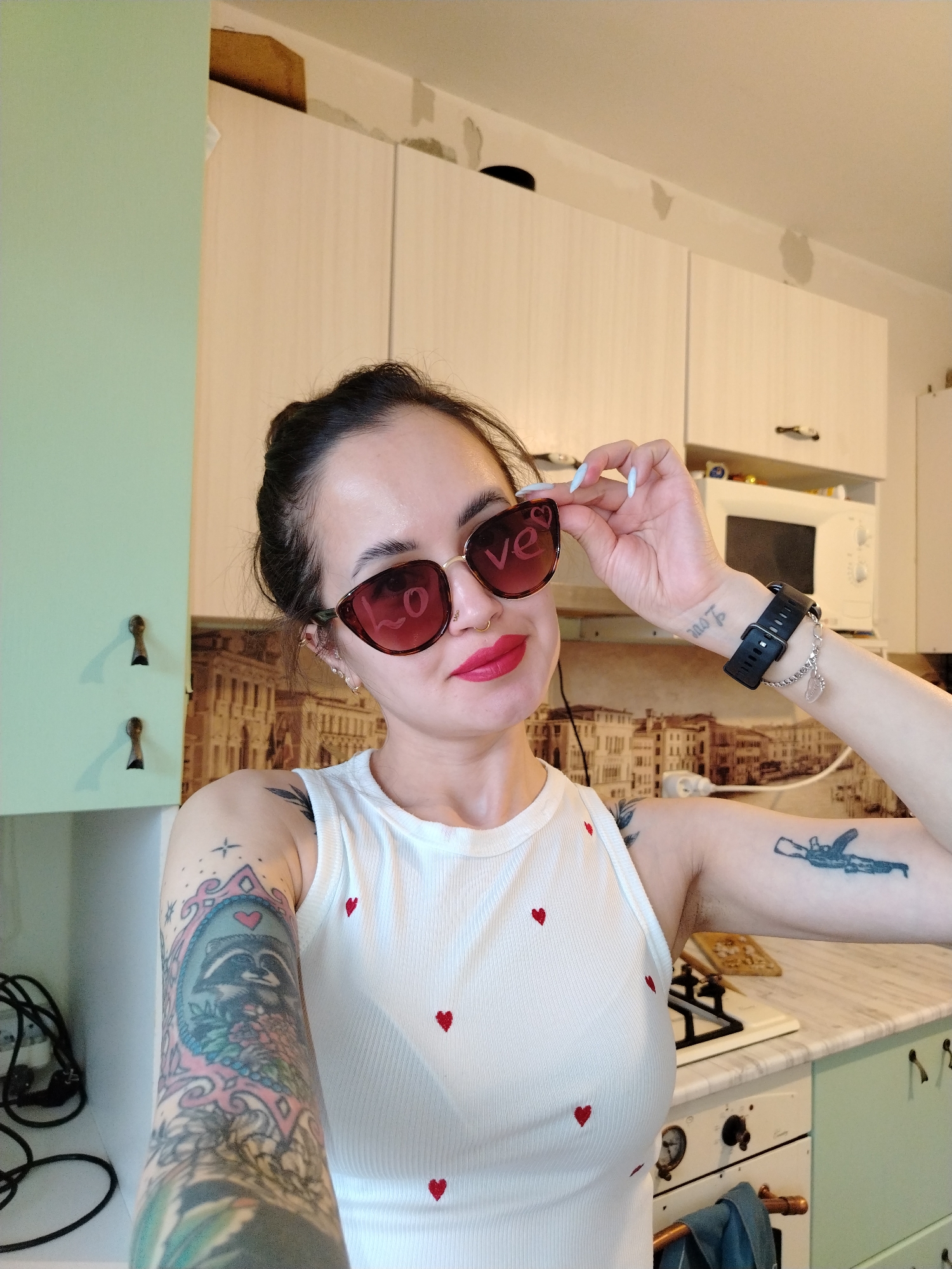 Woman documents lunch with Middle Eastern food in Russian kitchen
