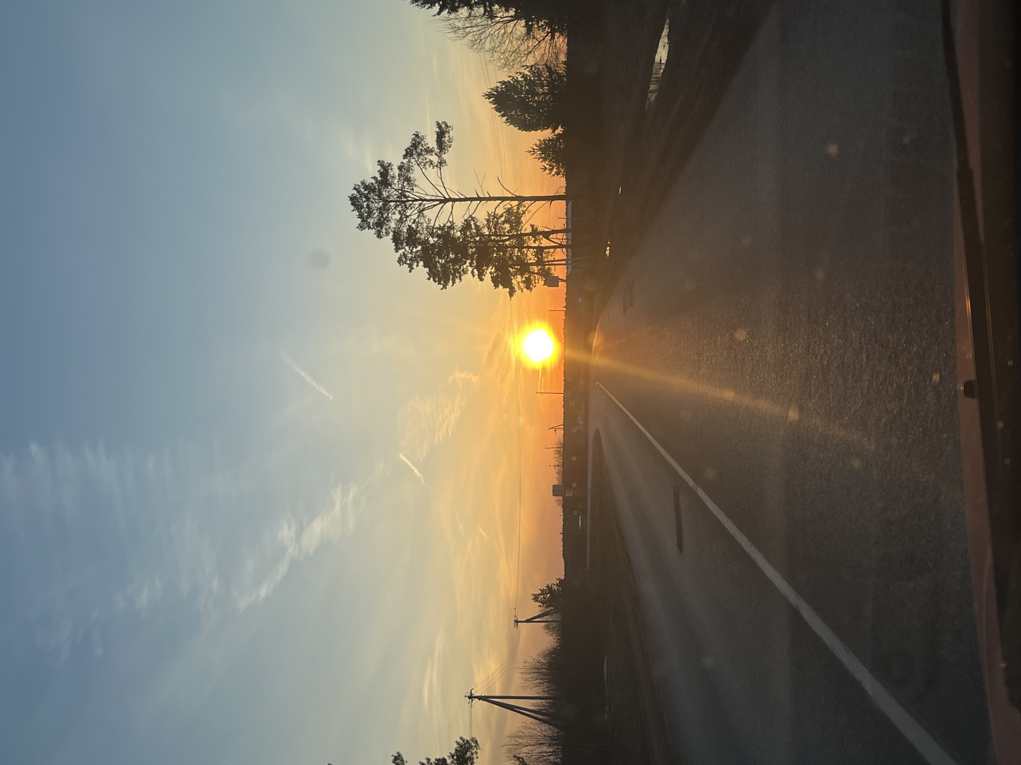 Sunset documented on rural road in Гаревая, Russia