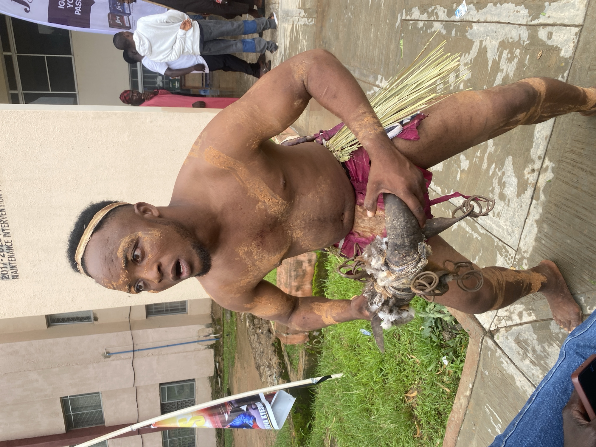 Traditional ceremony with mud-adorned participants in Rafin Par, Nigeria