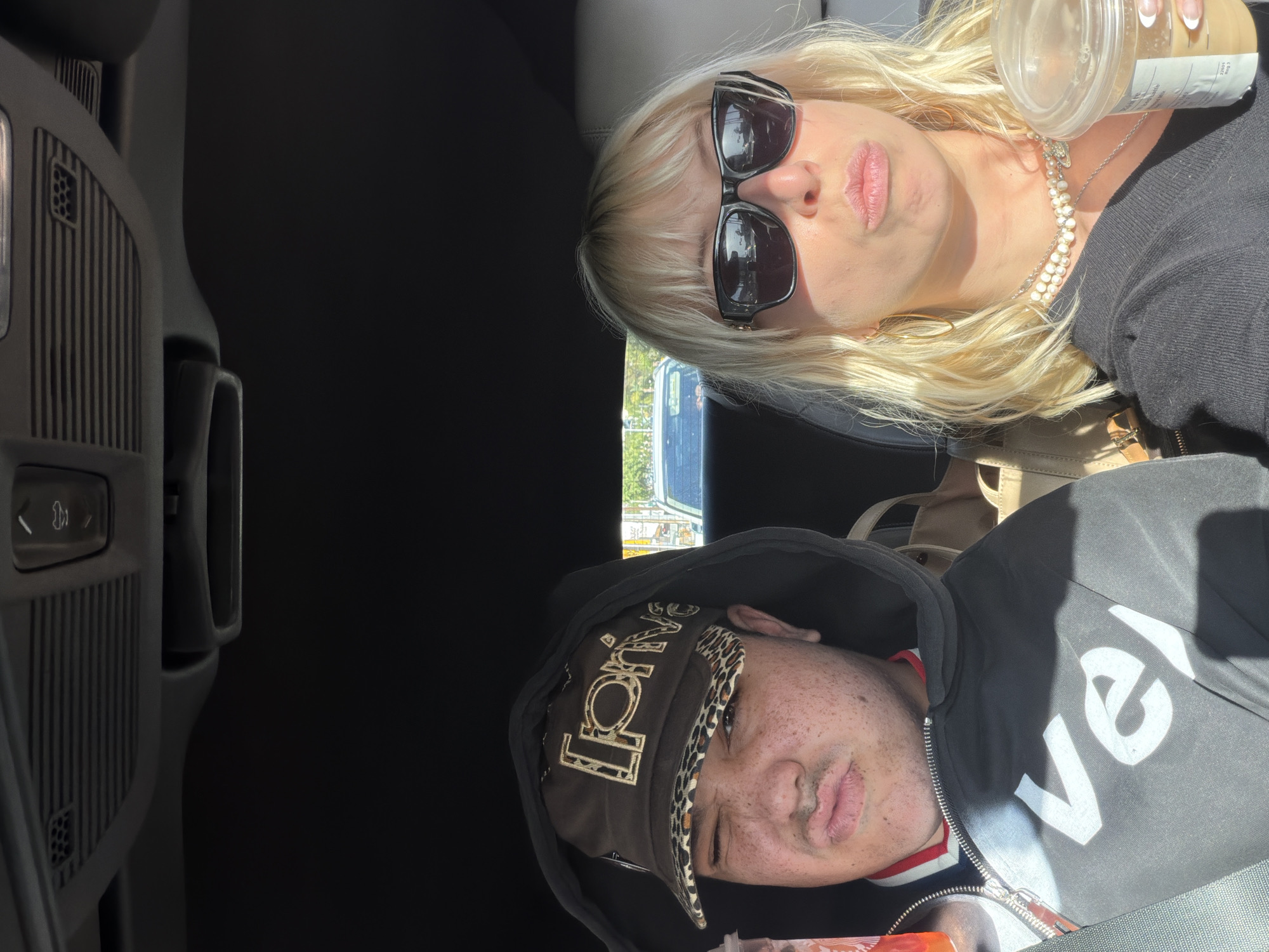 Two people photographed in car from above in West Hollywood
