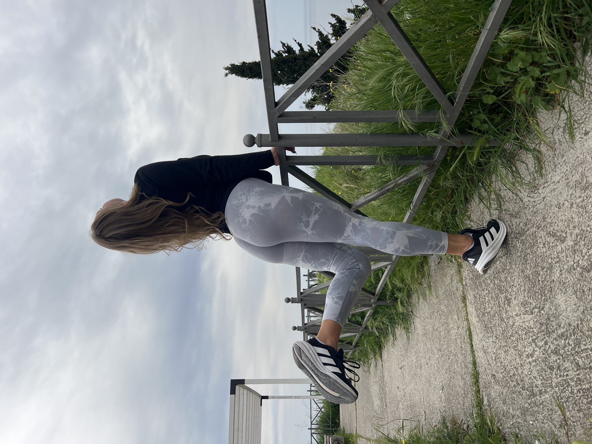 Woman leans against railing in Prijevor, Montenegro