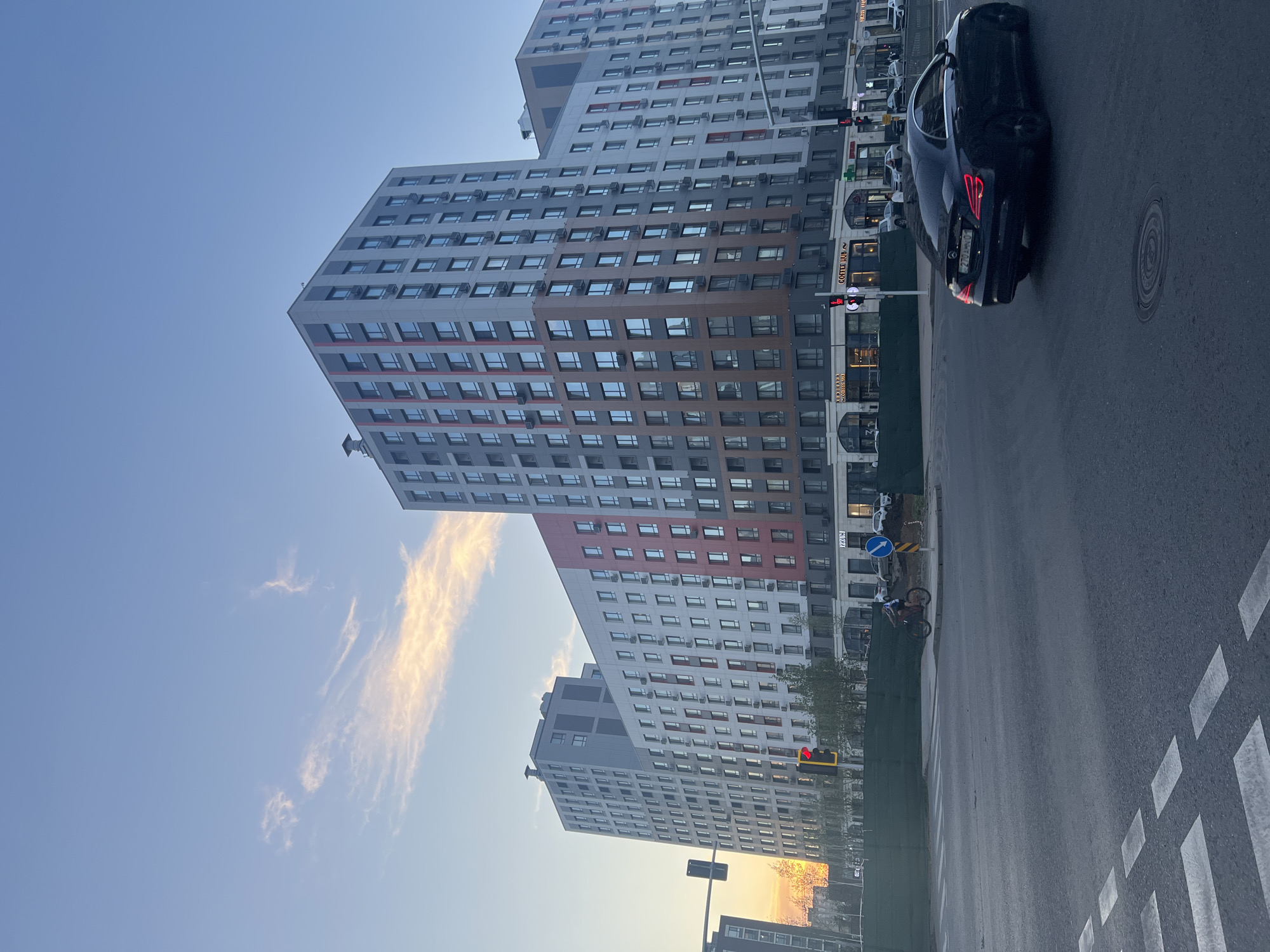 Late afternoon street life across modern Astana neighborhoods