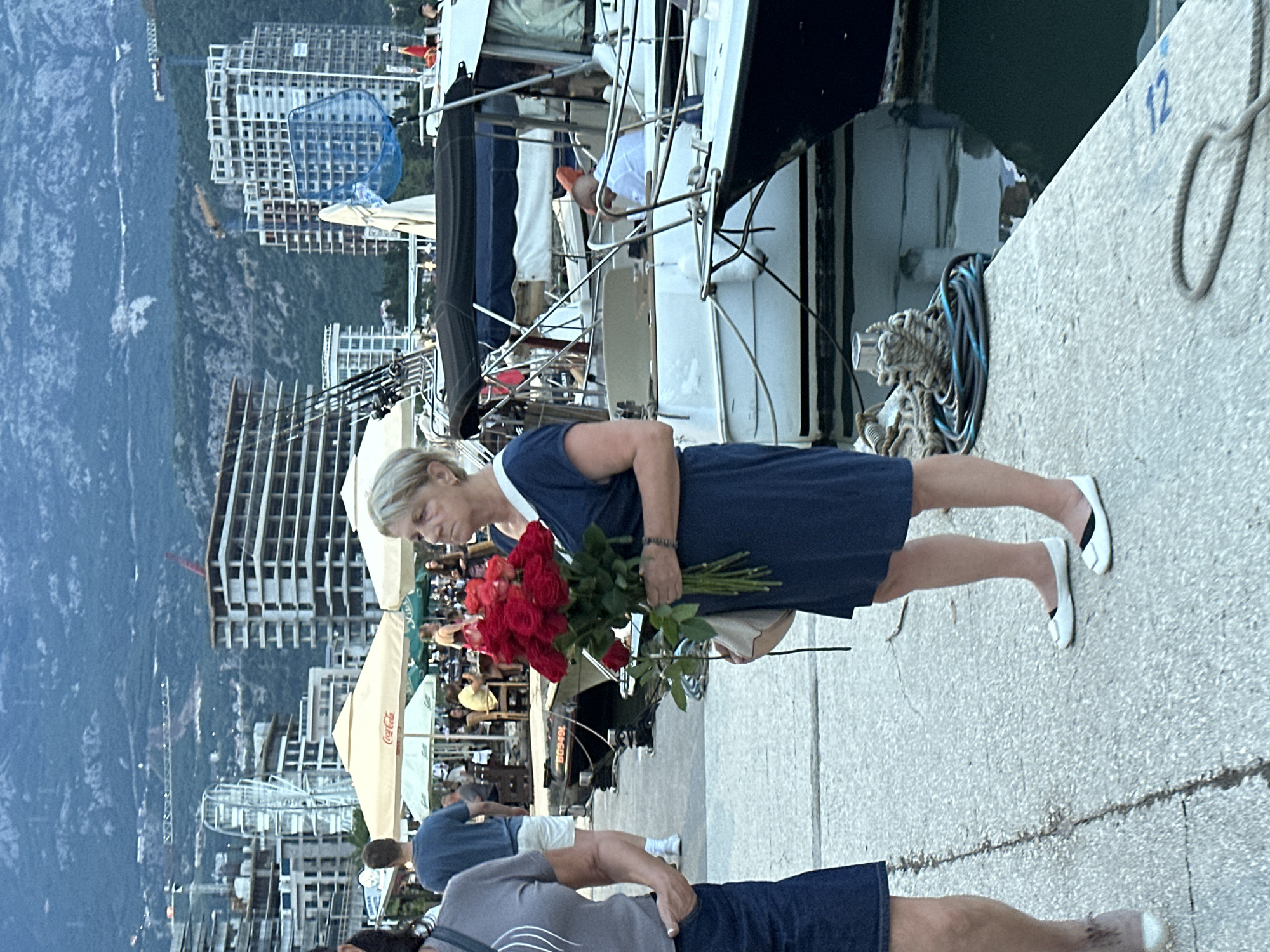 Budva marina at dusk: yachts, ducks, and waterfront life