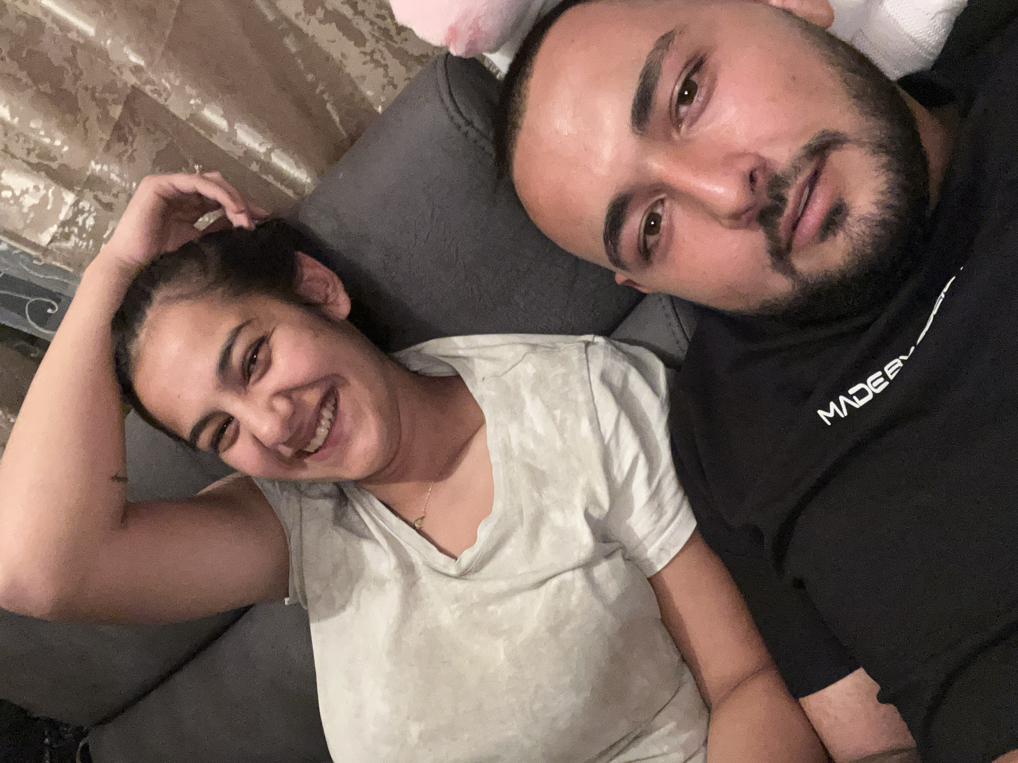 Couple shares relaxed moment on couch in Bulgarian village