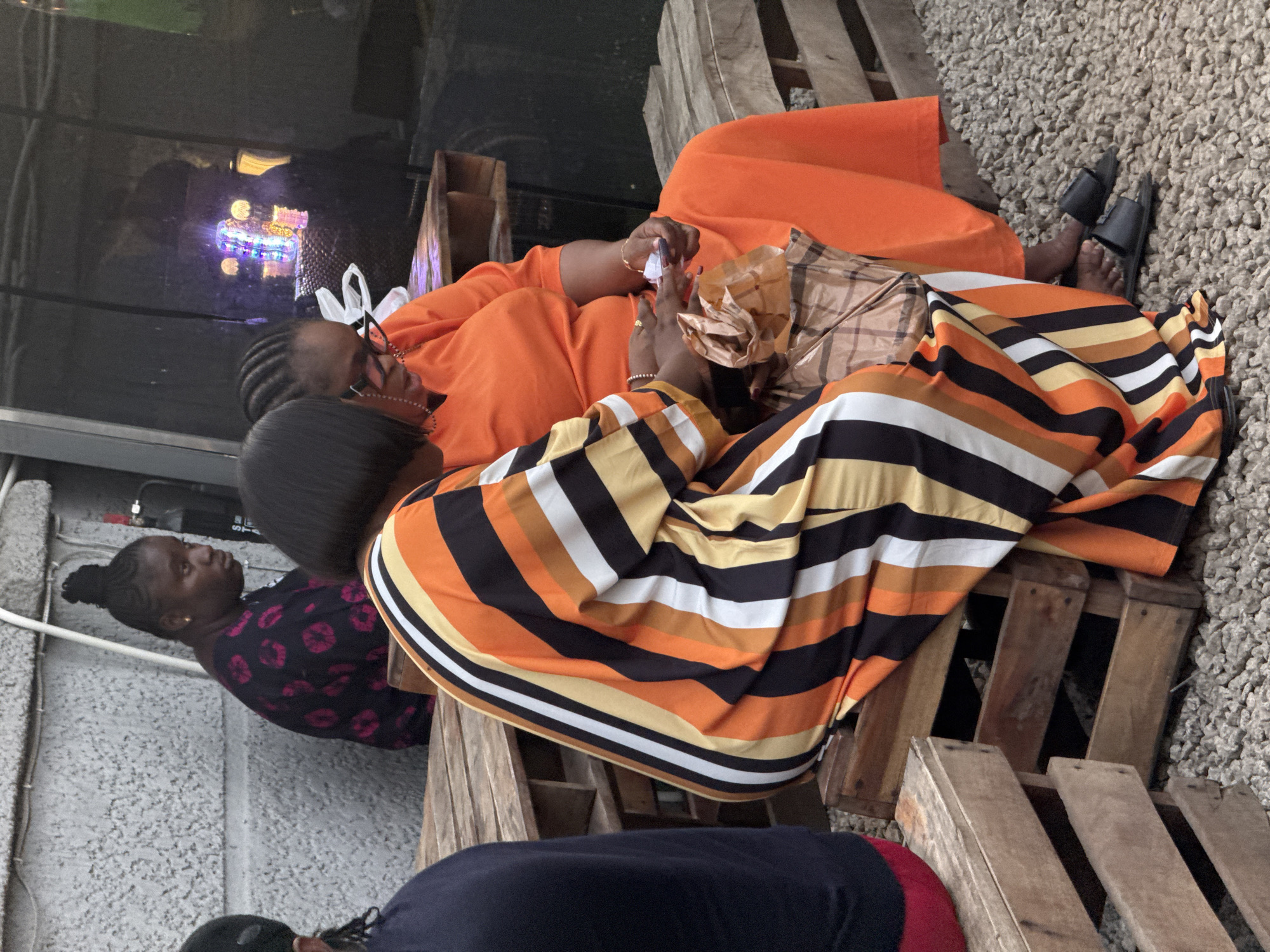 Women gather at outdoor food venue in Gwarinpa
