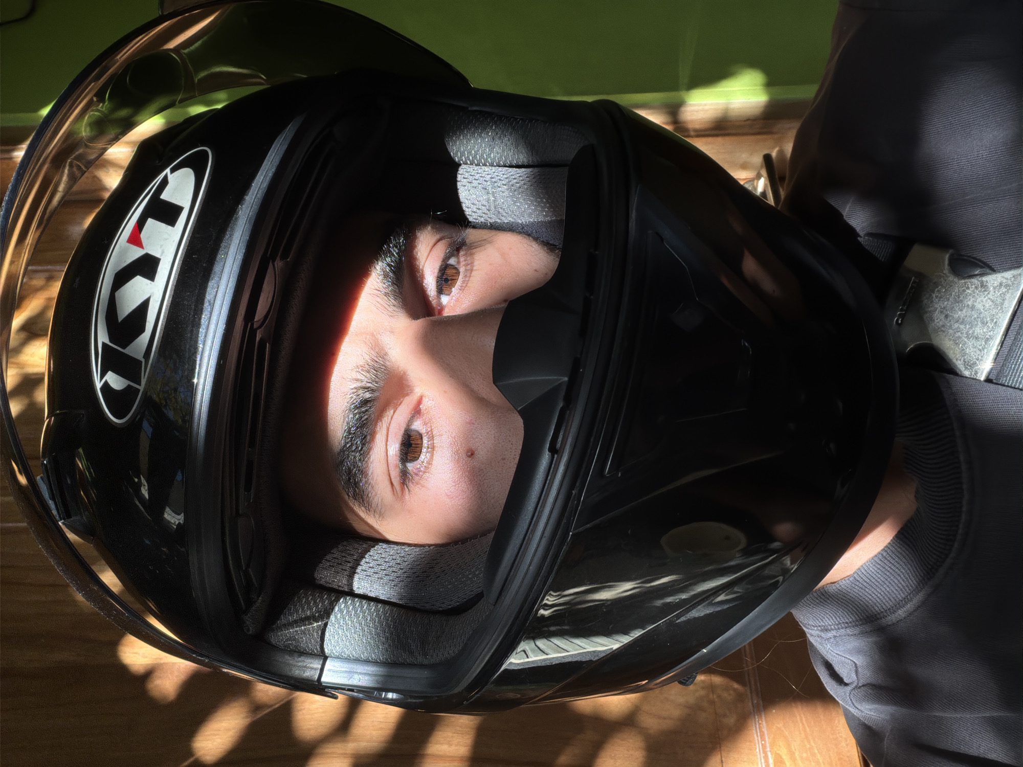 Motorcyclist observed during daytime ride through North Kuta streets