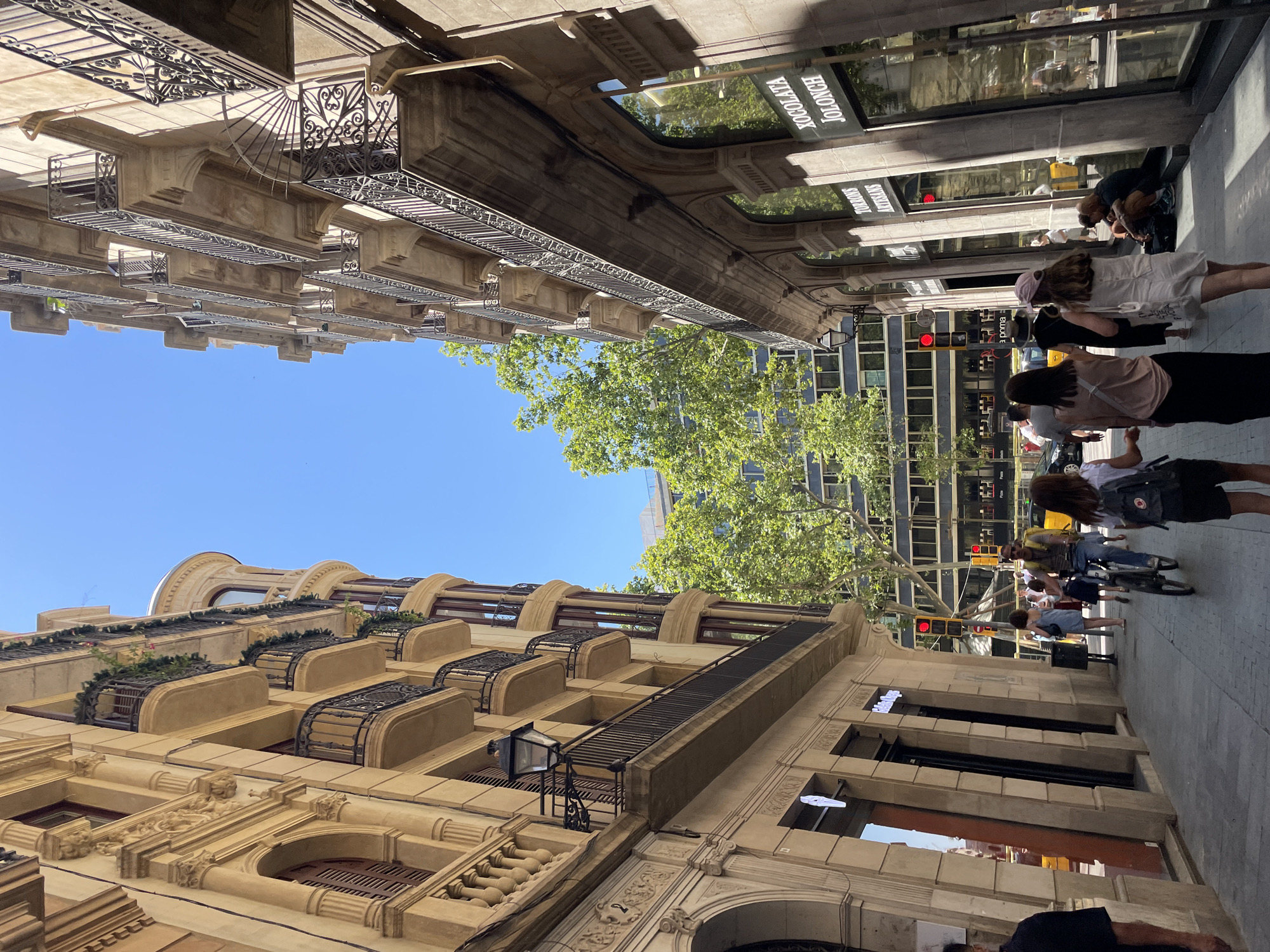 Street-level Barcelona: balconies, Las Ramblas, and midday sun