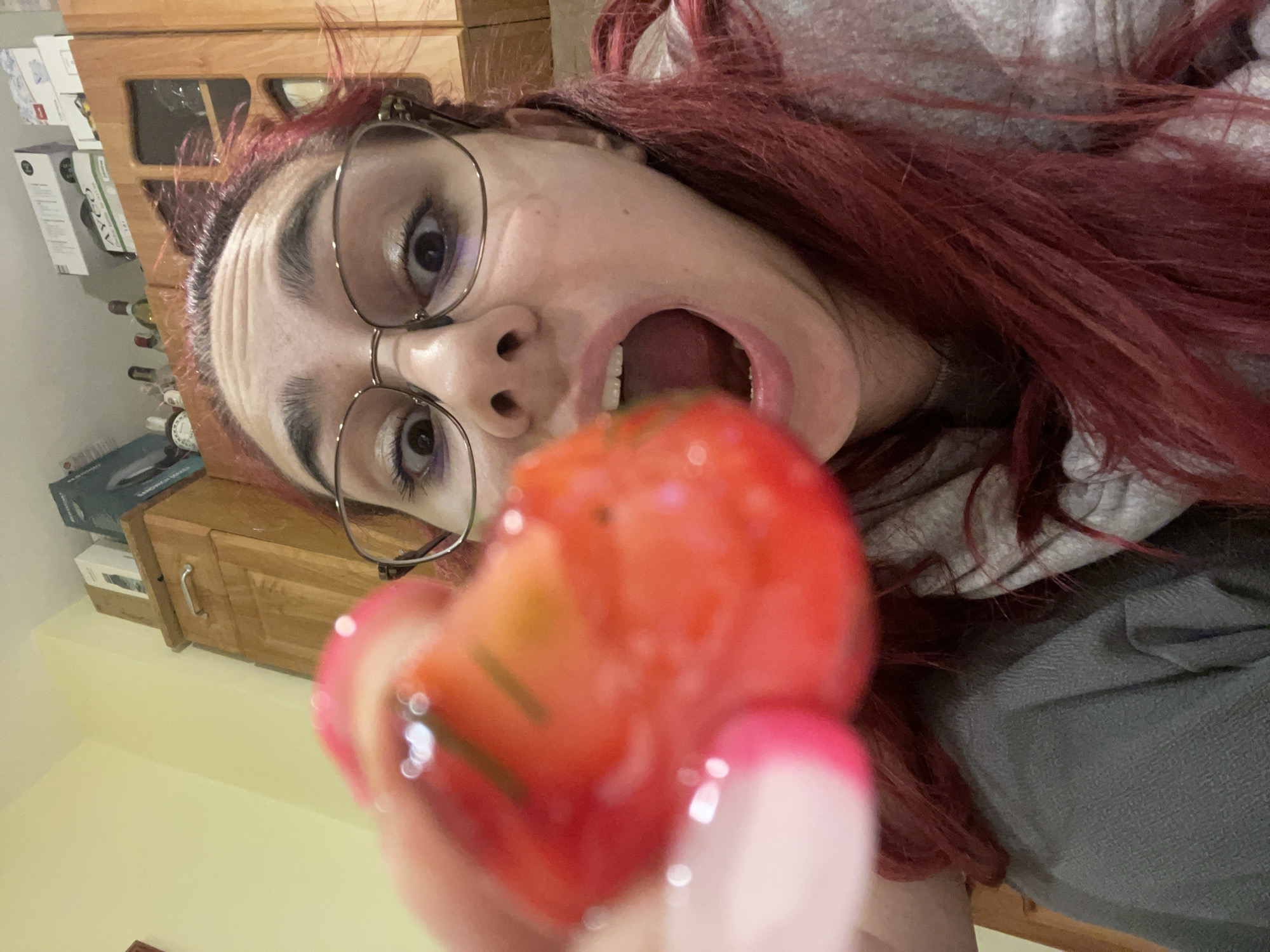Woman enjoys fruit and pickled radishes in Pleven home