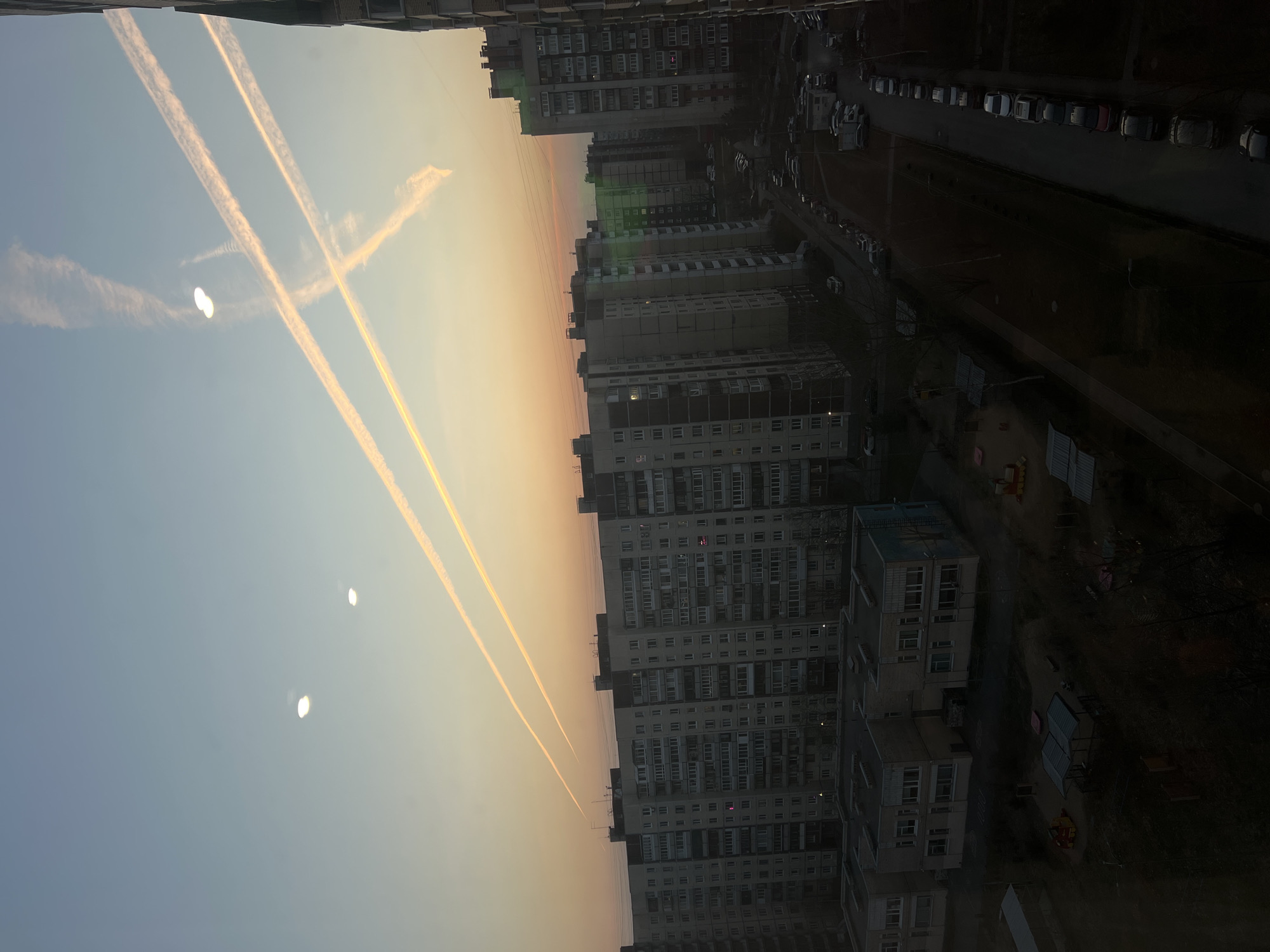 Apartment window views capture Saint Petersburg cityscape at dusk
