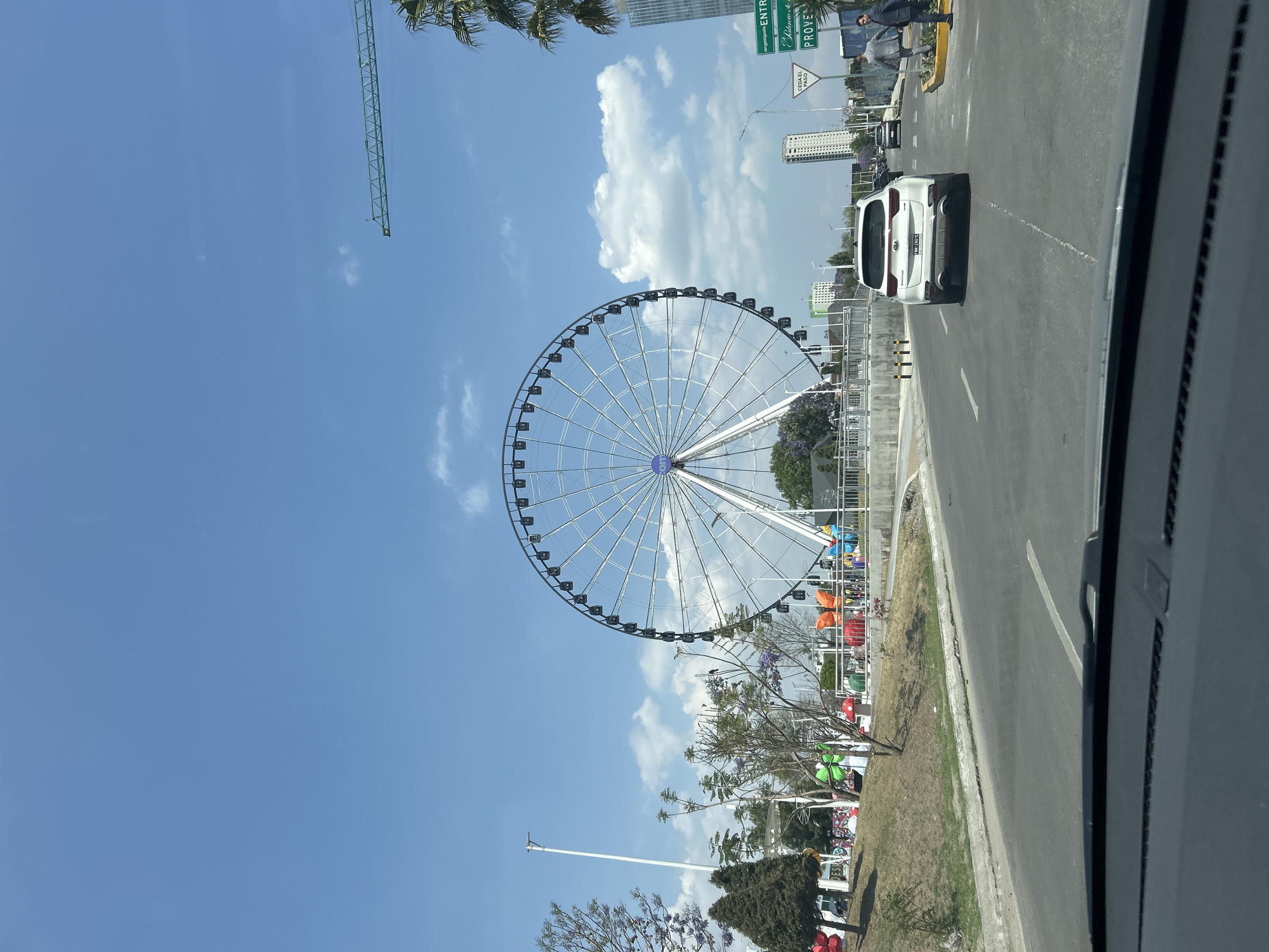 Urban scenes capture construction, Ferris wheel, retail shopping