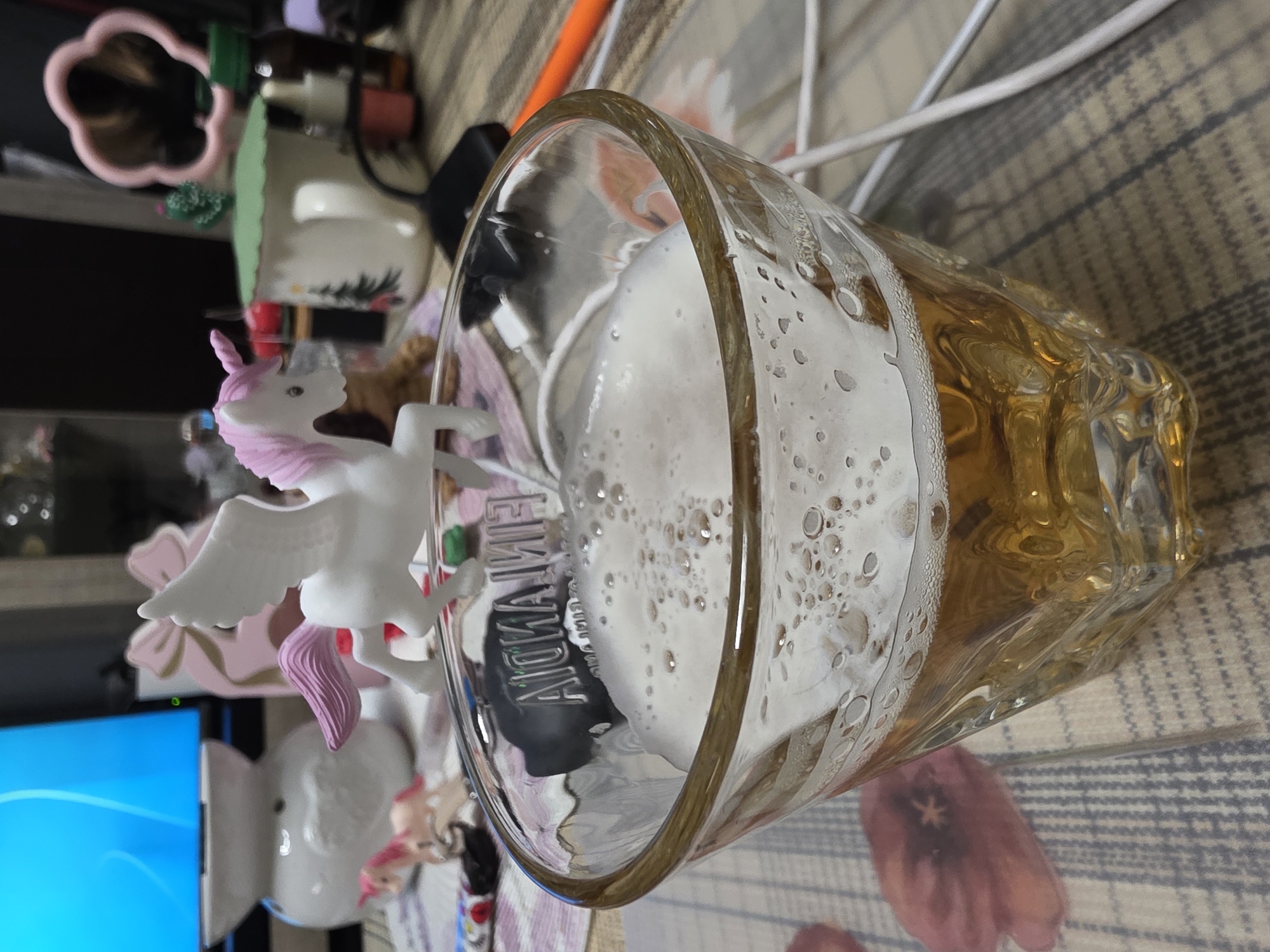 Beer and unicorn figurine photographed together in Bulgaria