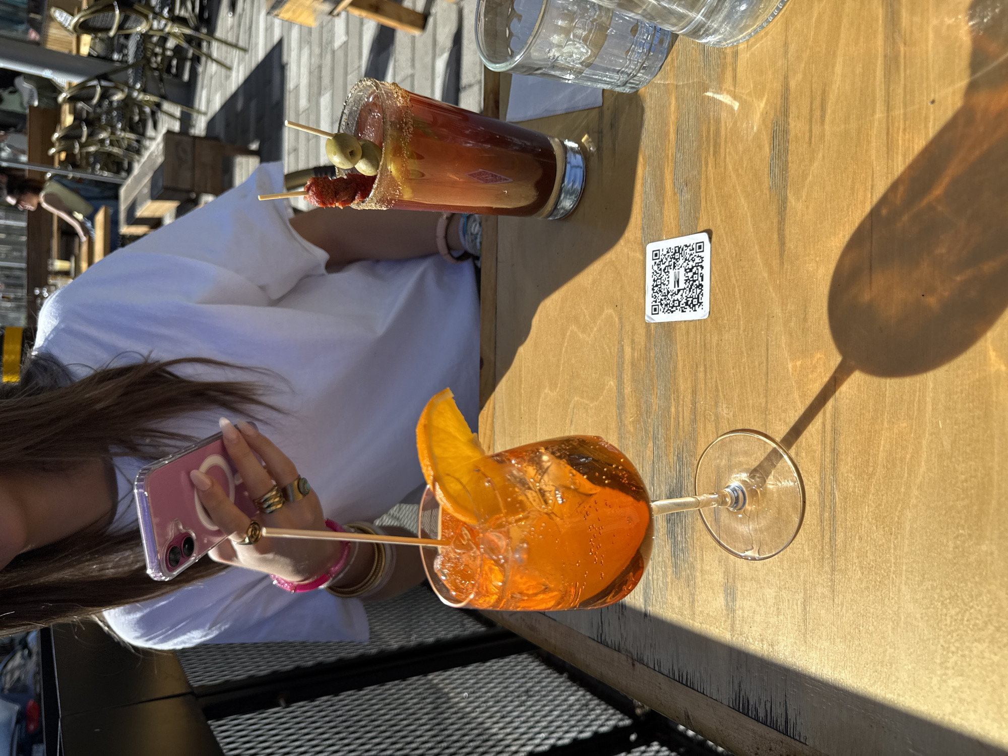 Cocktails and sunny evening captured at Montreal outdoor venue