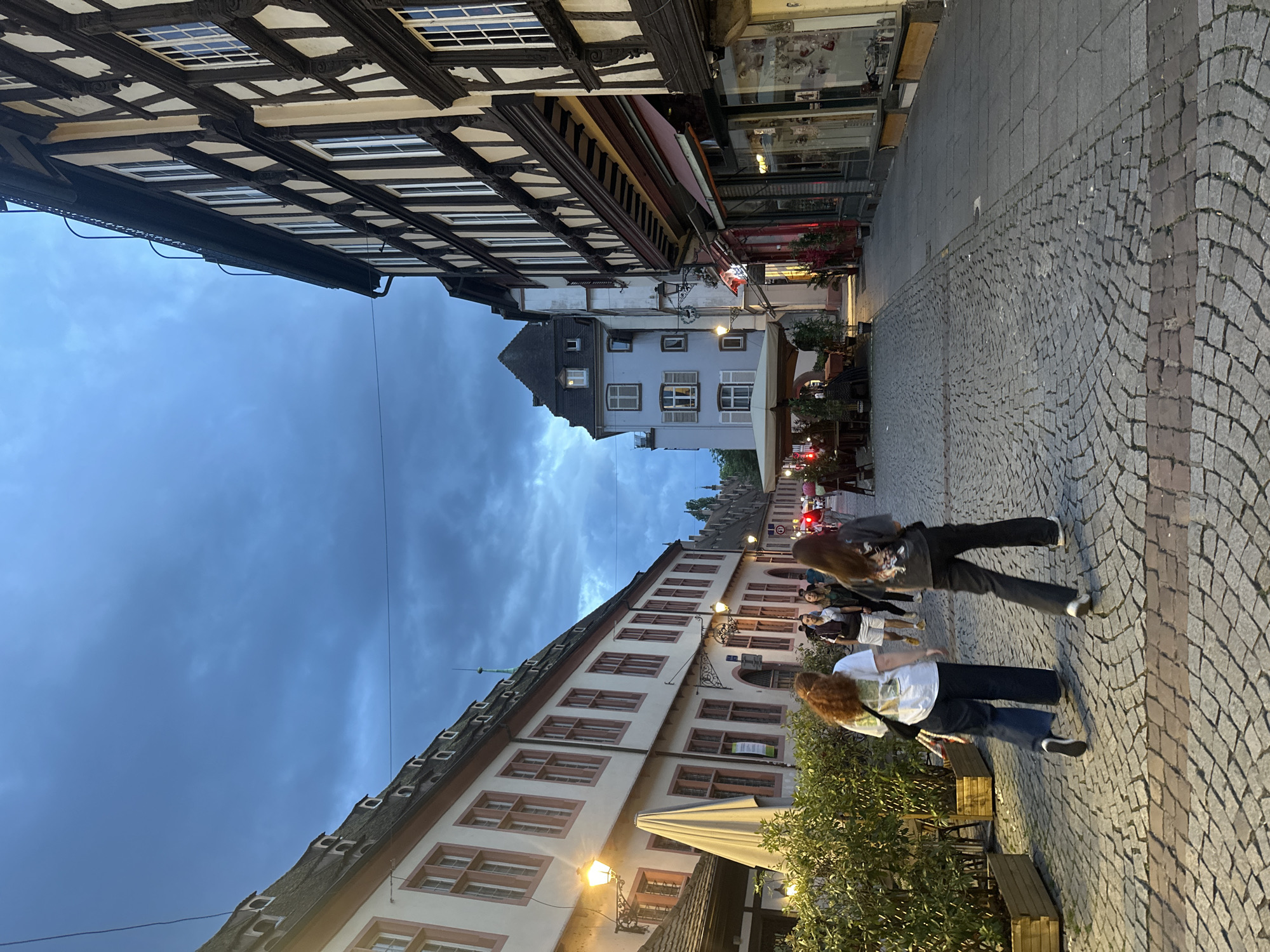 Evening stroll documented through historic Strasbourg's cobblestone streets