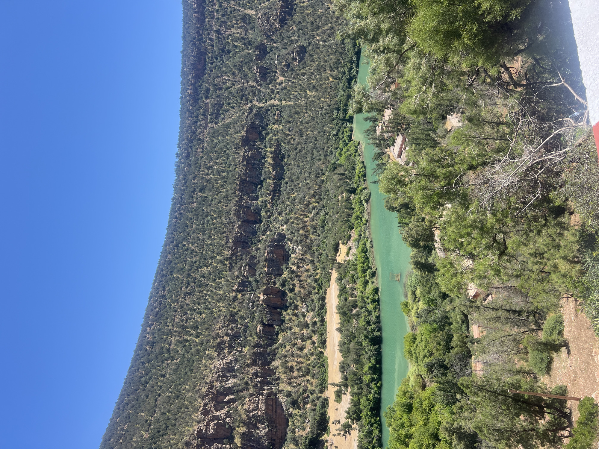 Green river winds through dramatic gorge near Bin El Ouidane