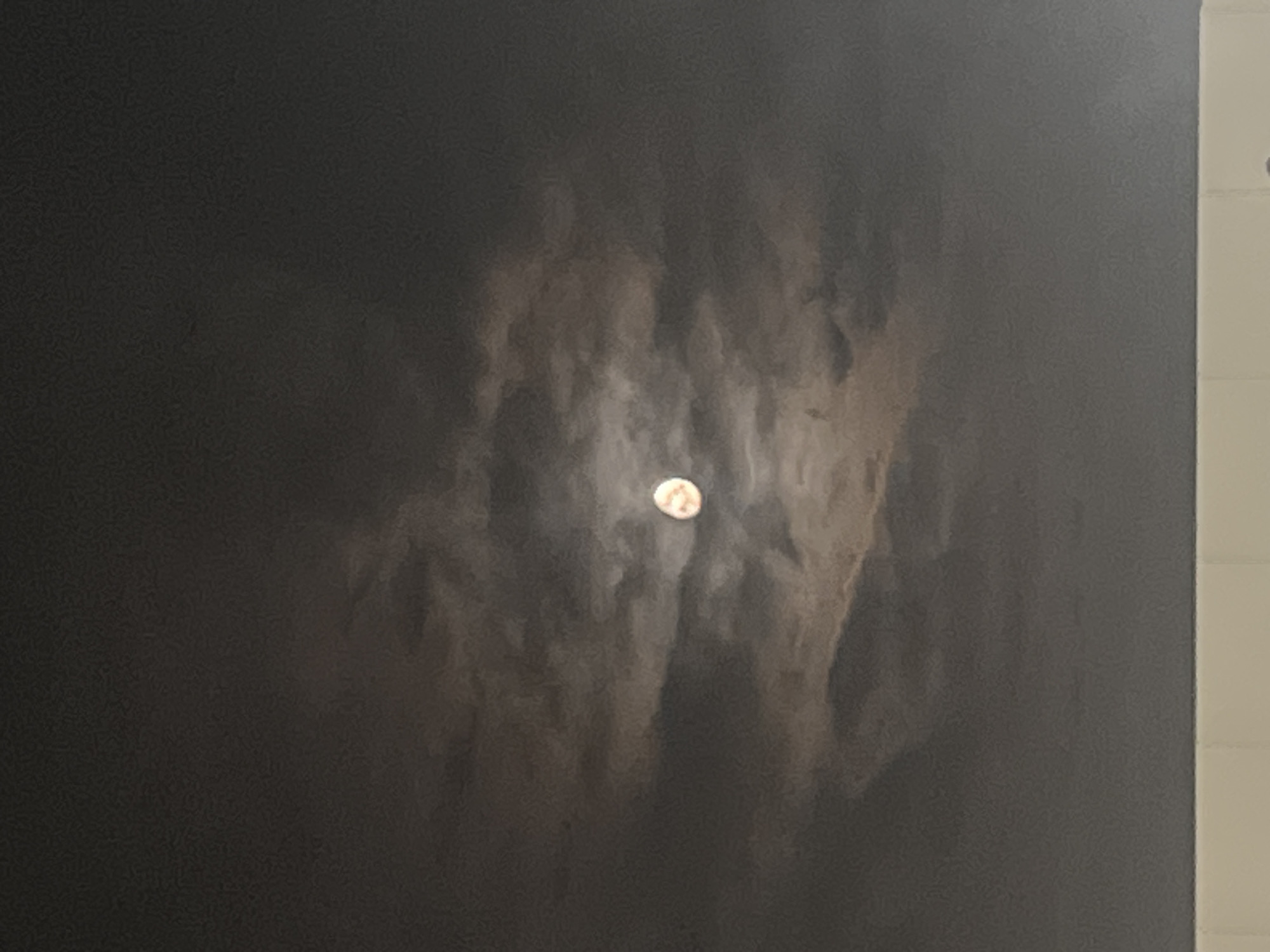 Moon observation captured through clouds in Lupanovo, Russia