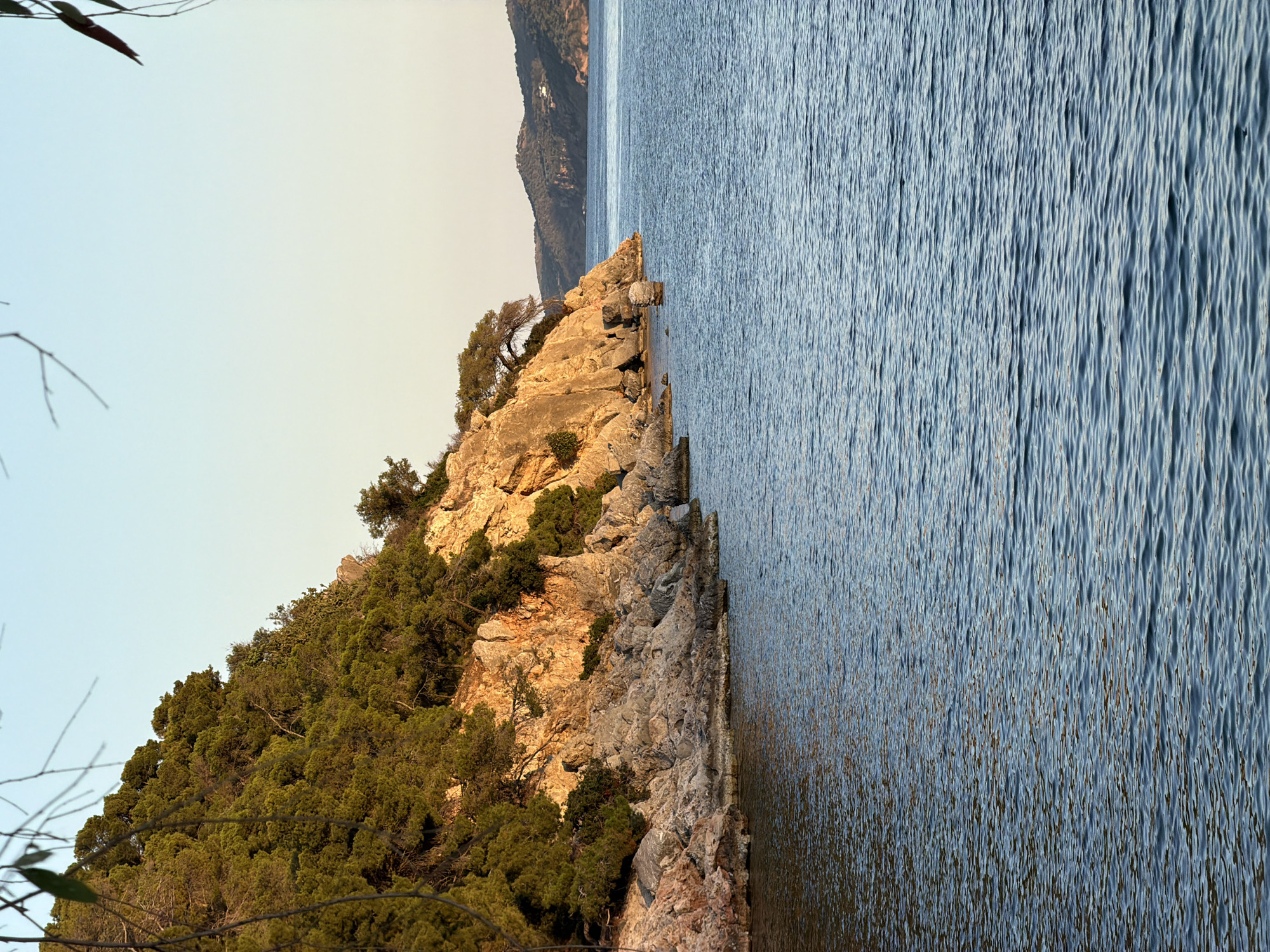 Peaceful coastal scenes documented across Poros, Greece during evening hours
