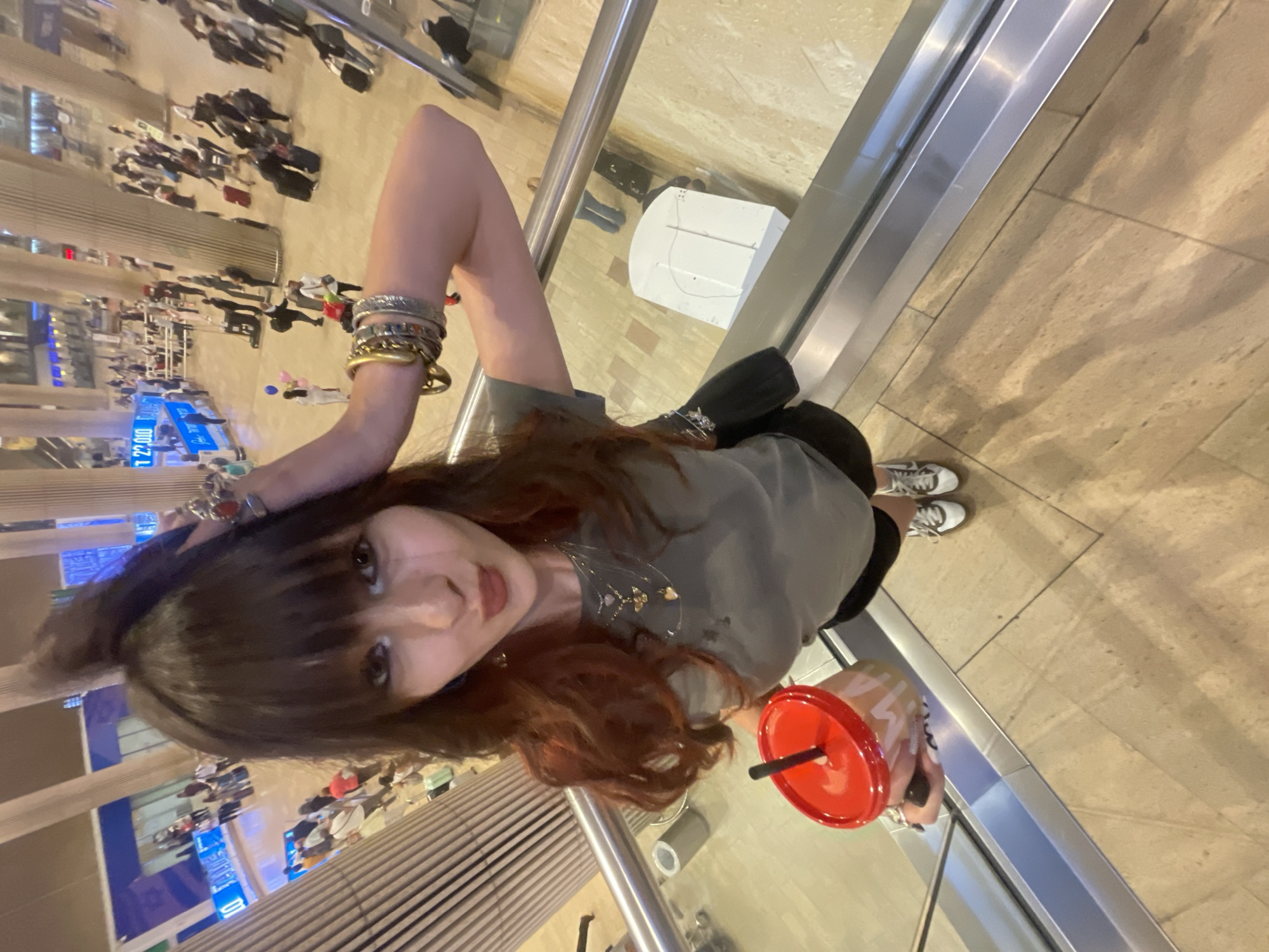 Young women take playful selfies in Israeli airport terminal