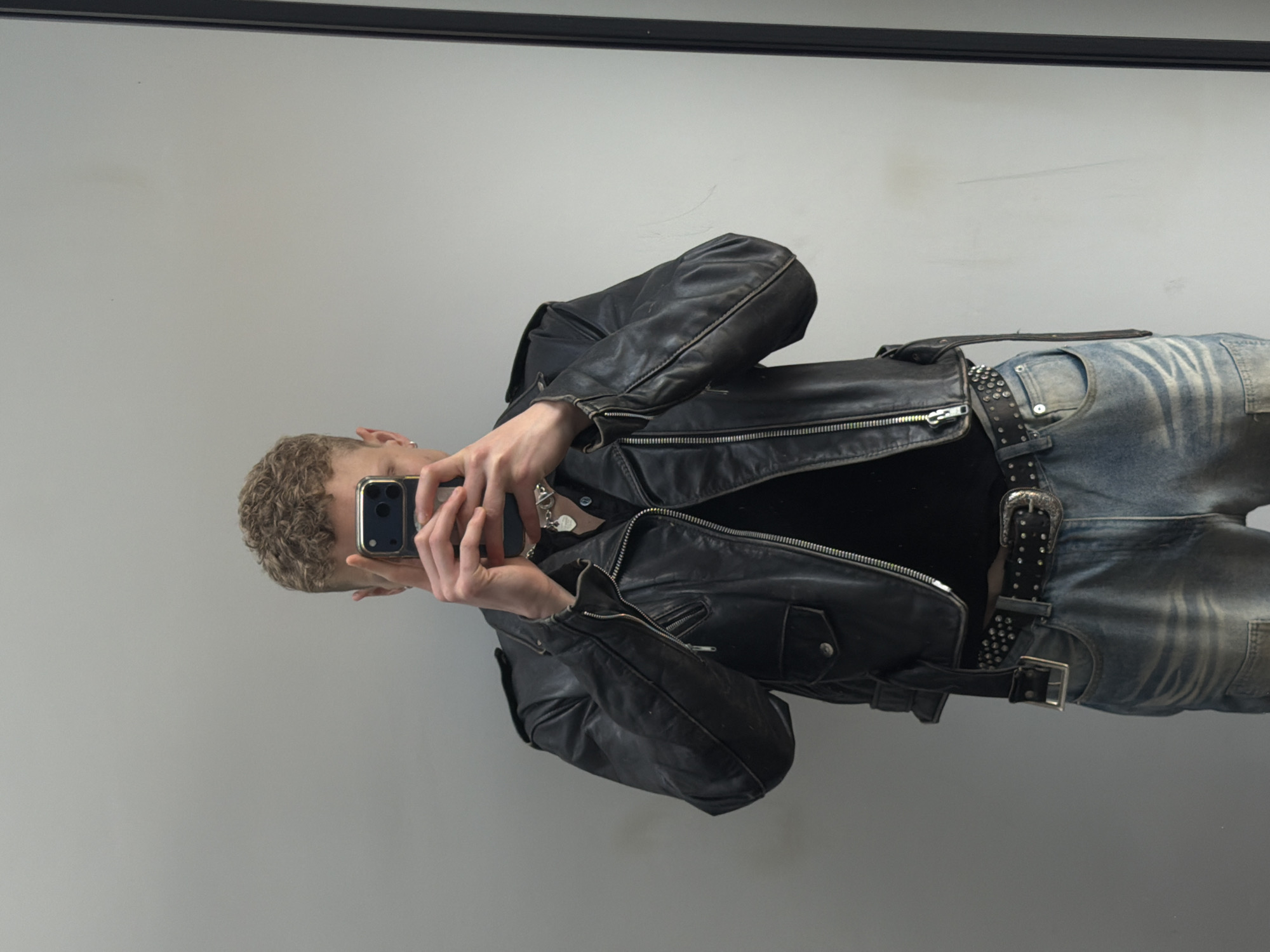 Person Takes Mirror Selfie in Black Leather Jacket, London