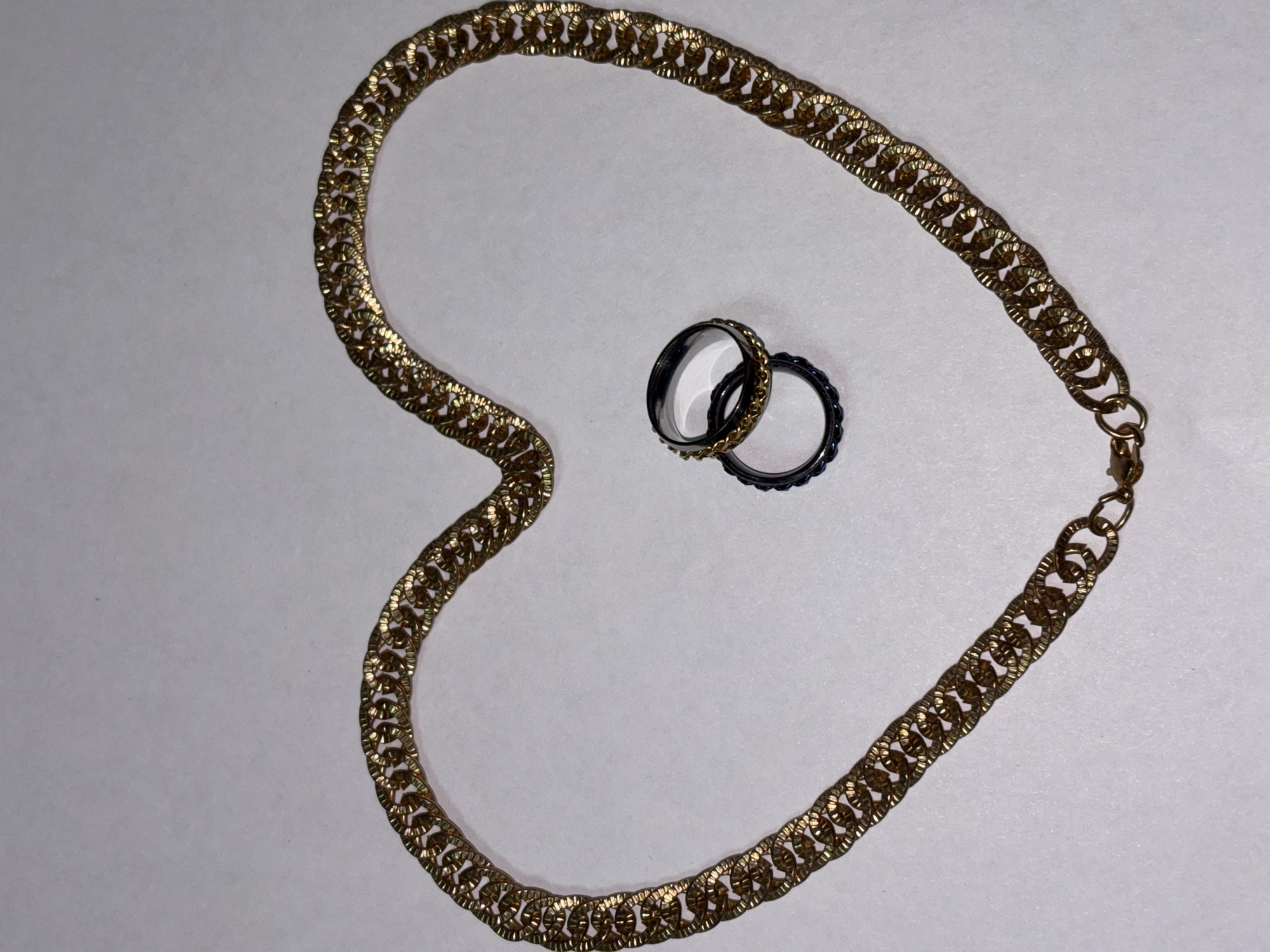 Jewelry collection laid out and styled across everyday surfaces