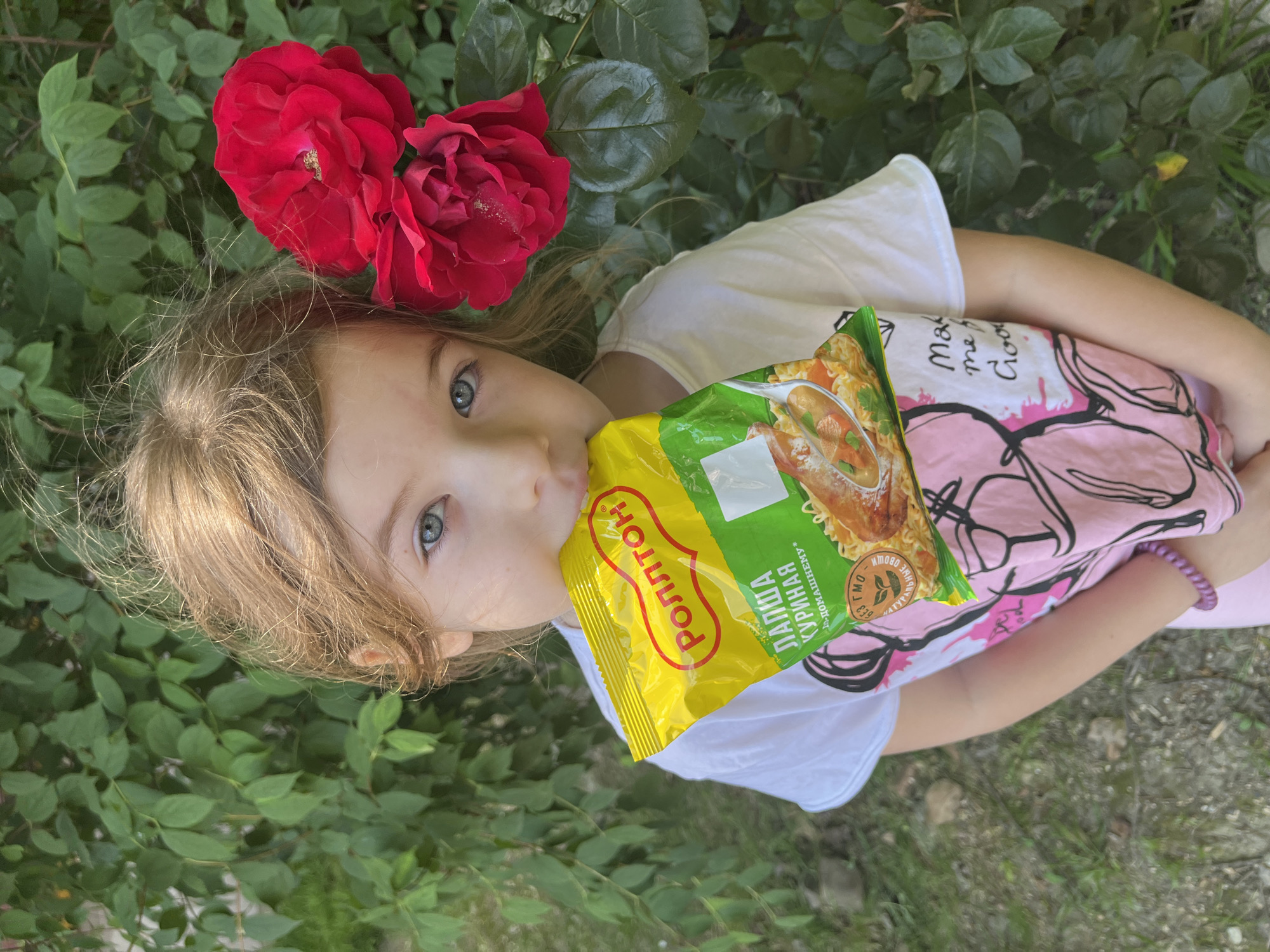 Child enjoys snacks, flowers during morning walk in Sochi
