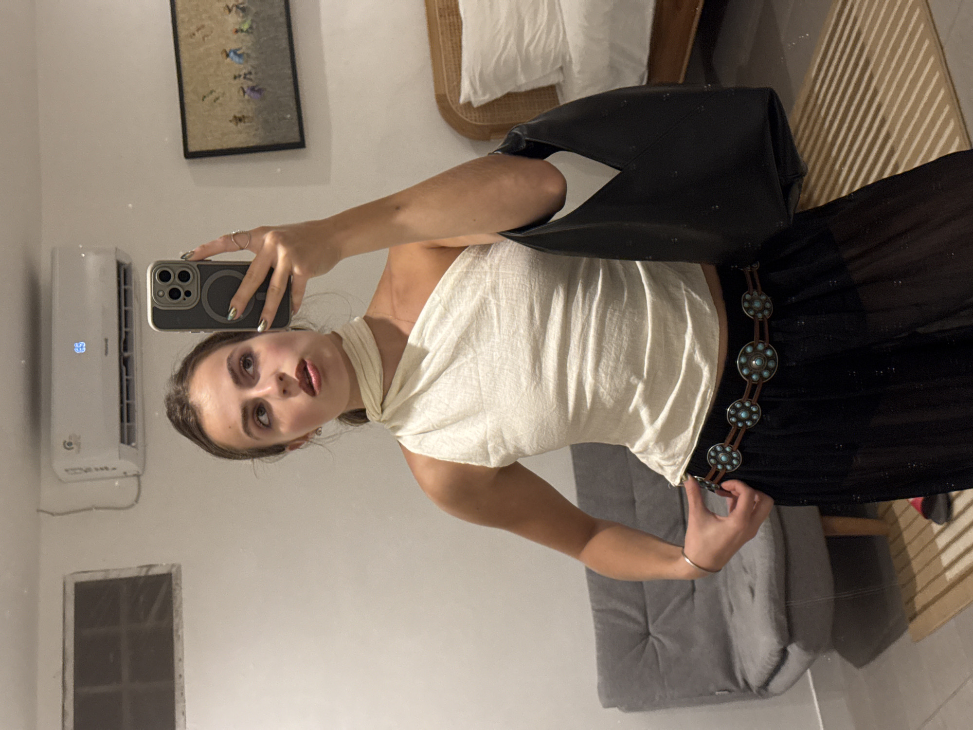 Mirror selfie in North Kuta bedroom, dressed to go out