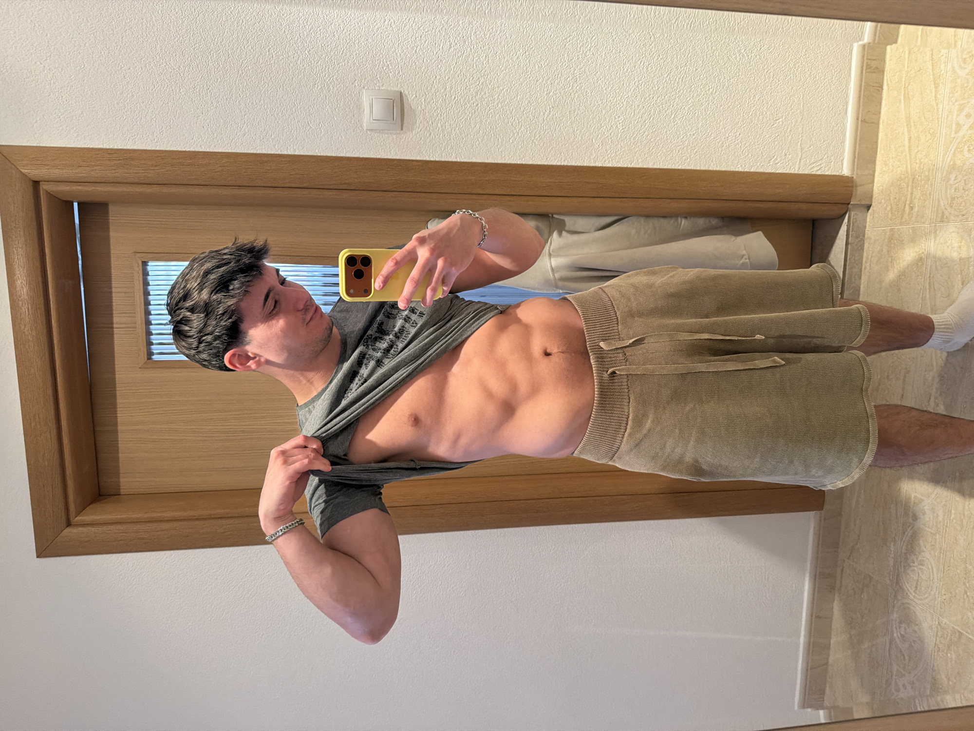 Person takes mirror selfies in Blagoevgrad room