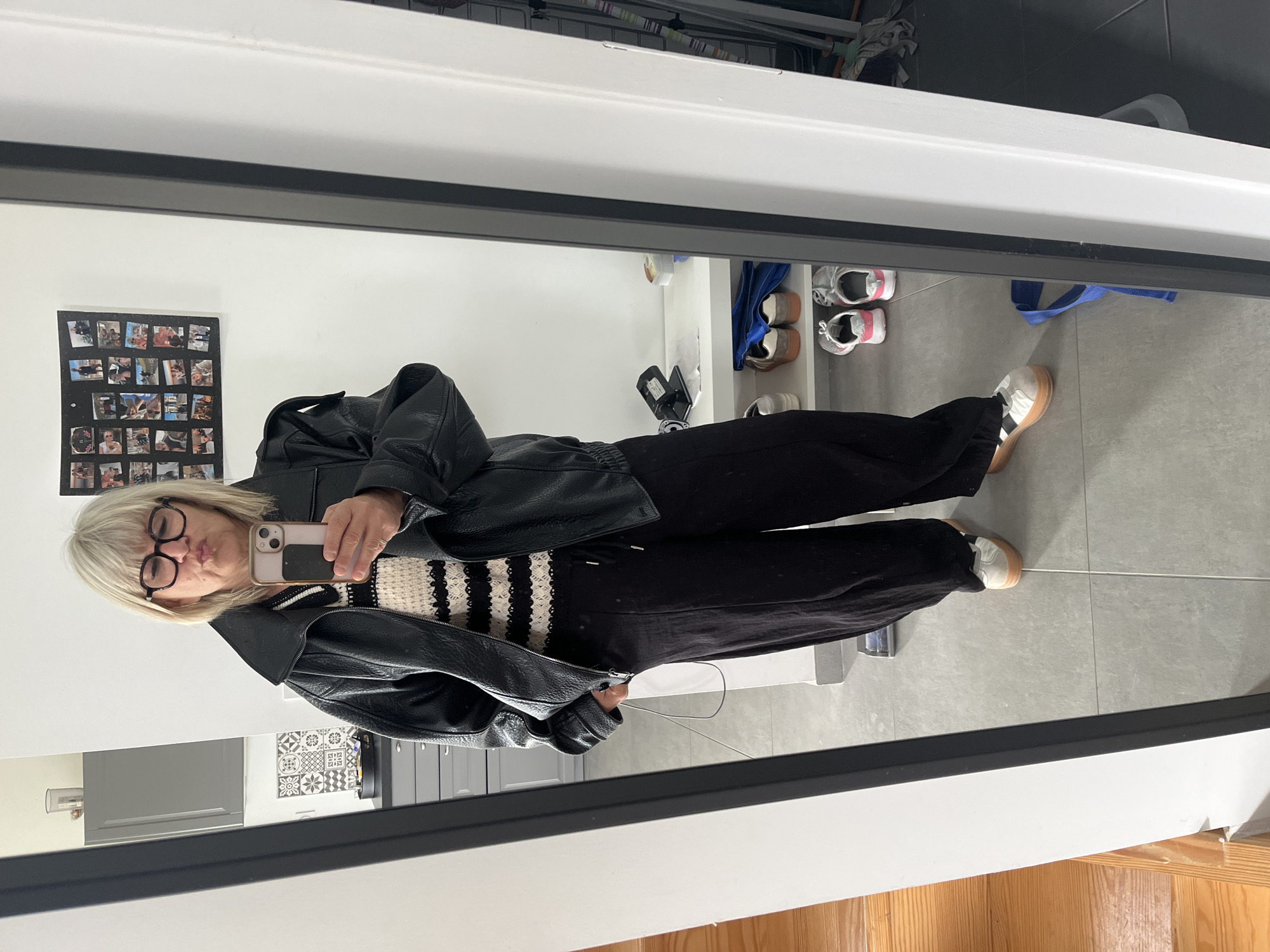 Woman takes bathroom mirror selfie in Chambœuf, France