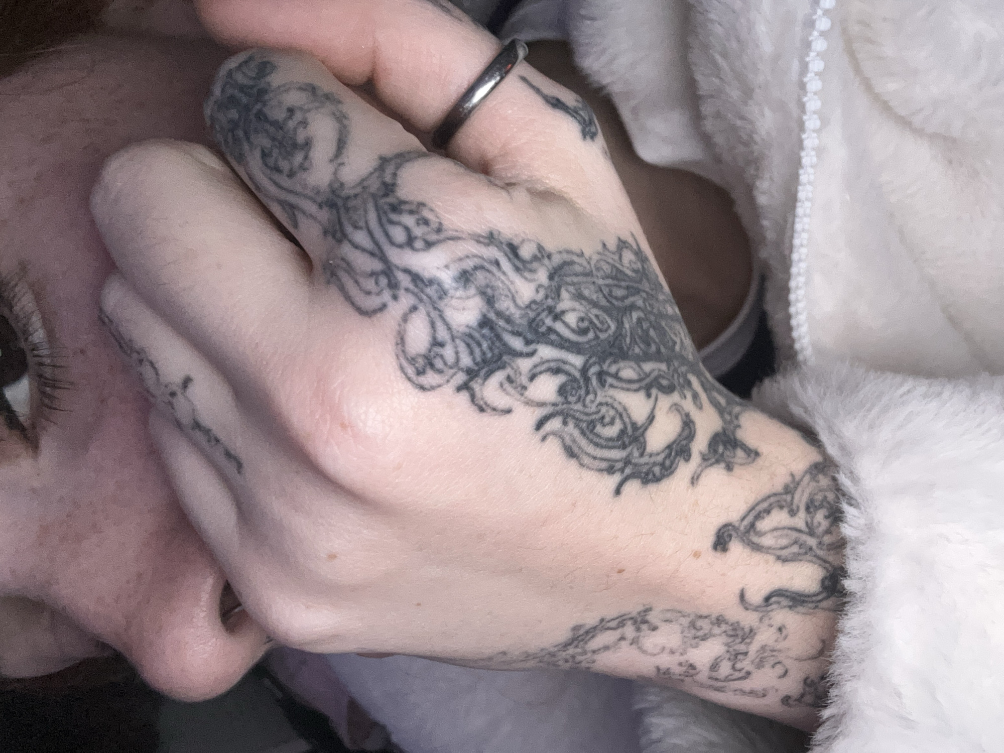 Tattooed close-up self-portraits shot indoors in Buenos Aires