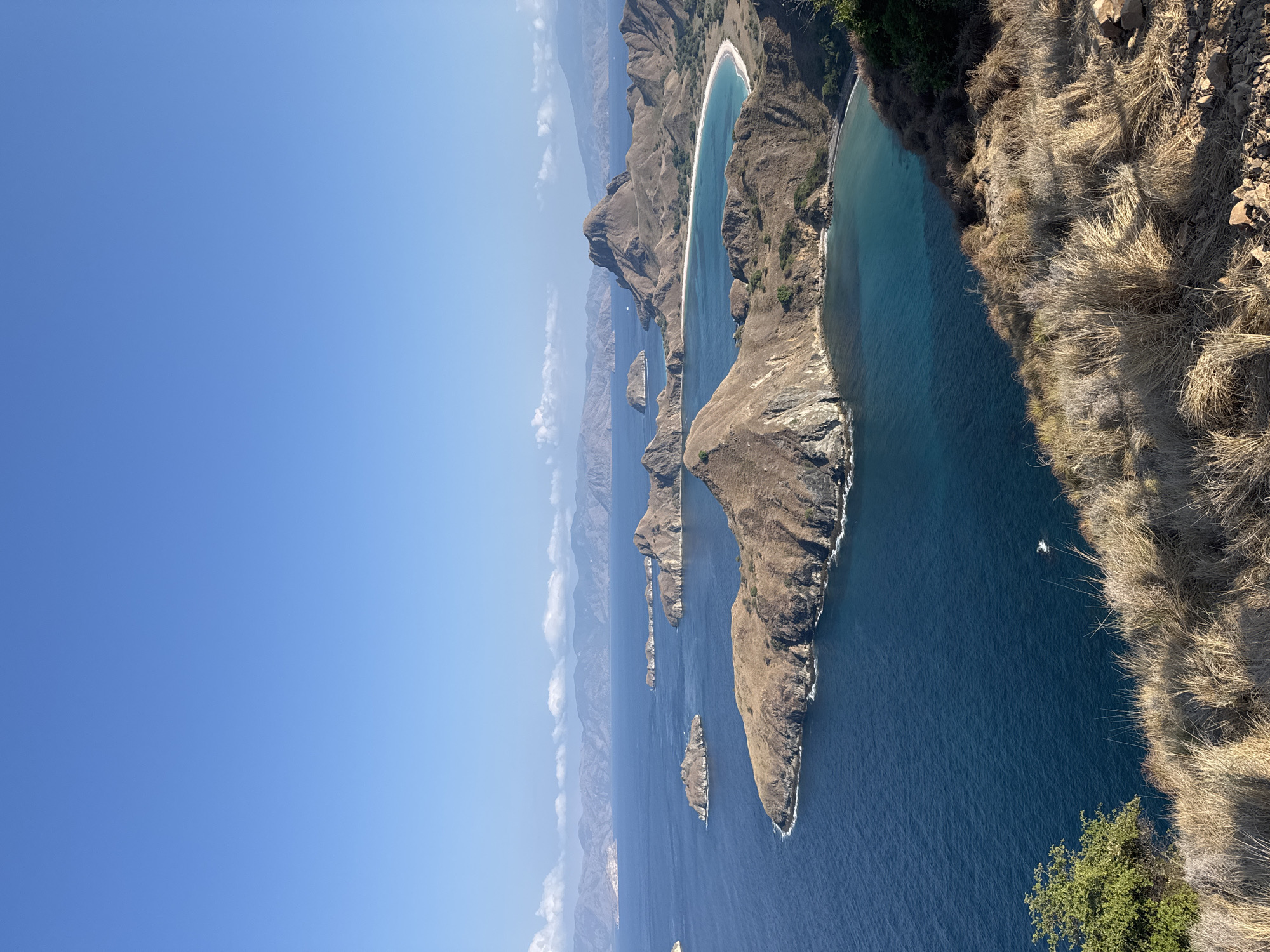 Clifftop views over Indonesia's island-dotted blue waters