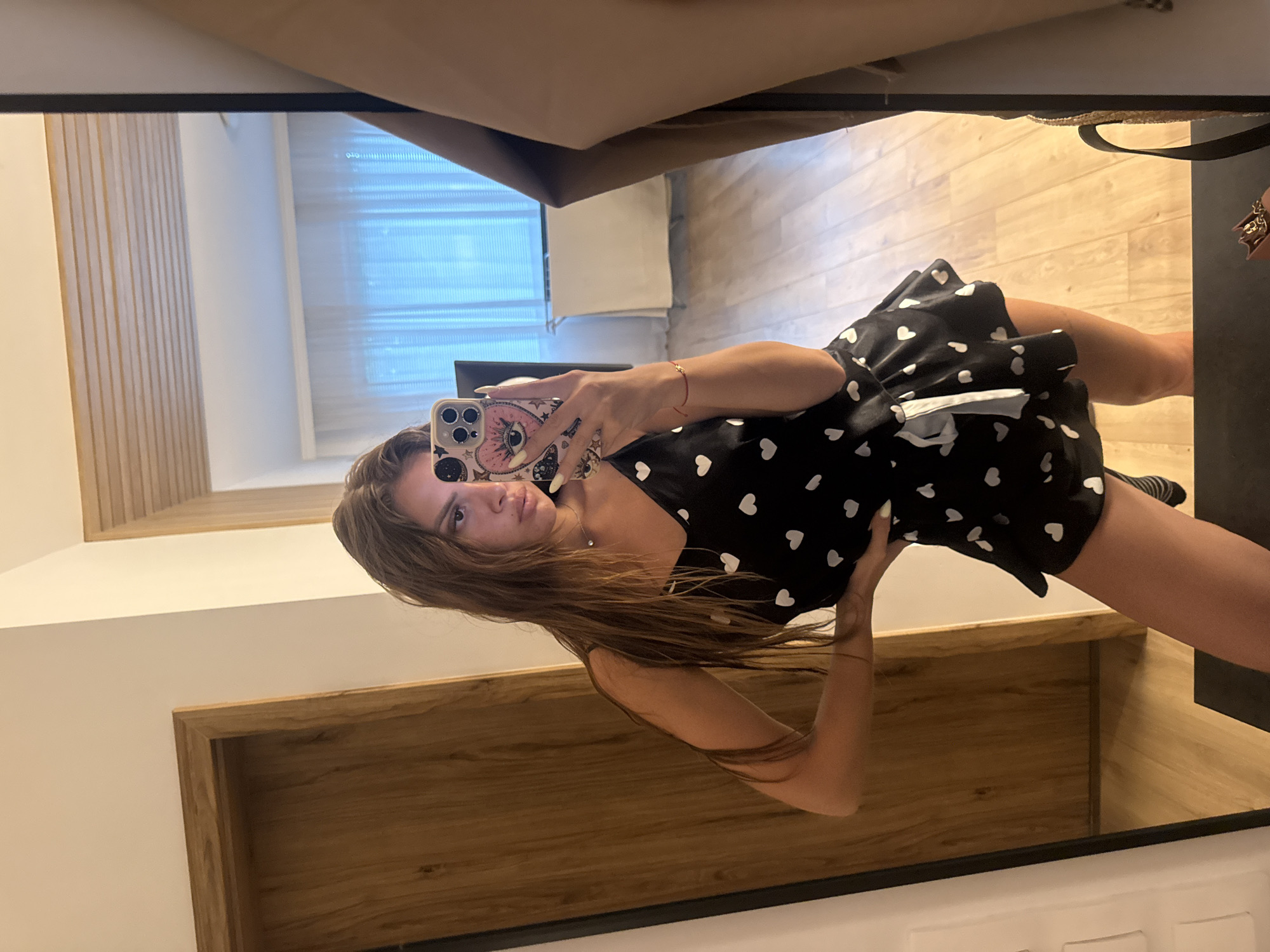 Mirror selfies in black heart-print outfit, Plovdiv apartment