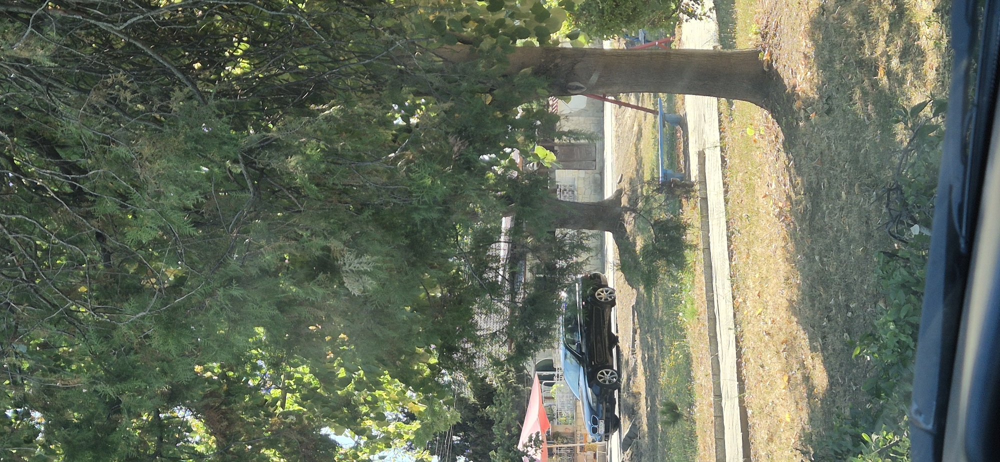 In-car drive through rural Bulgarian roads and neighborhoods