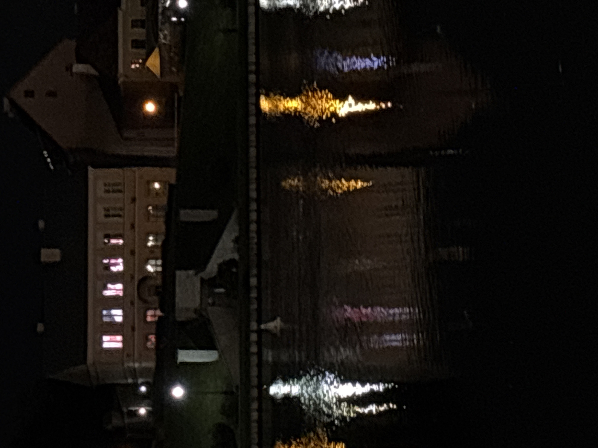 Nighttime photography session captures illuminated Minsk waterfront district