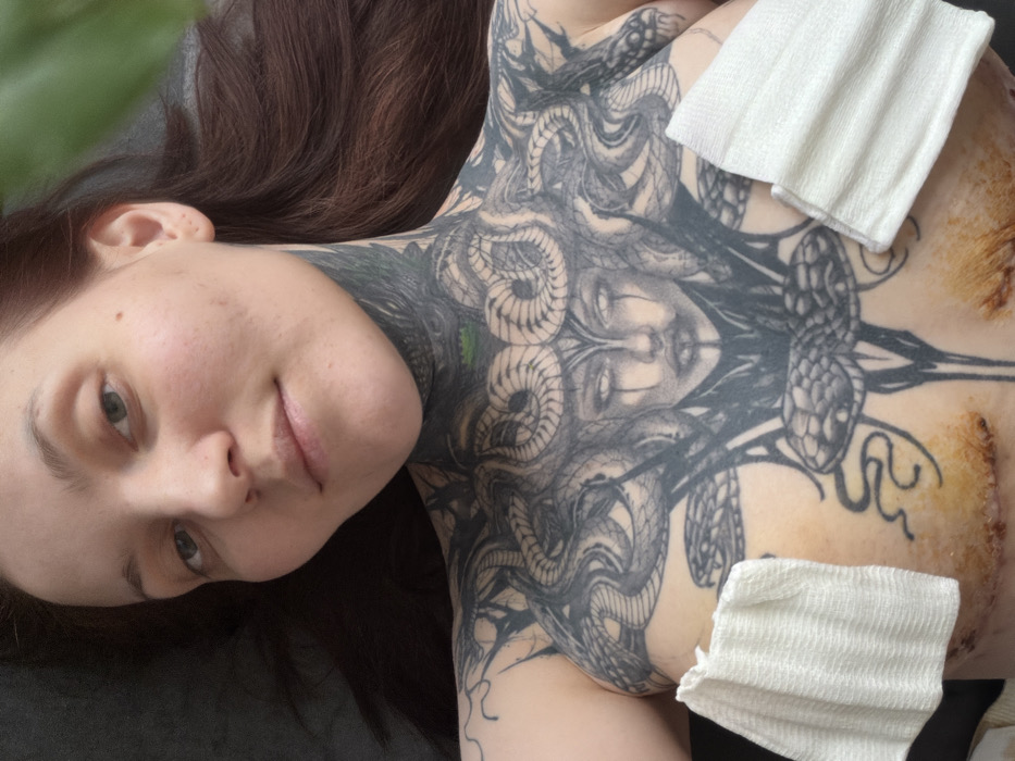 Tattooed woman documented through winter morning in Chaikovsky, Russia