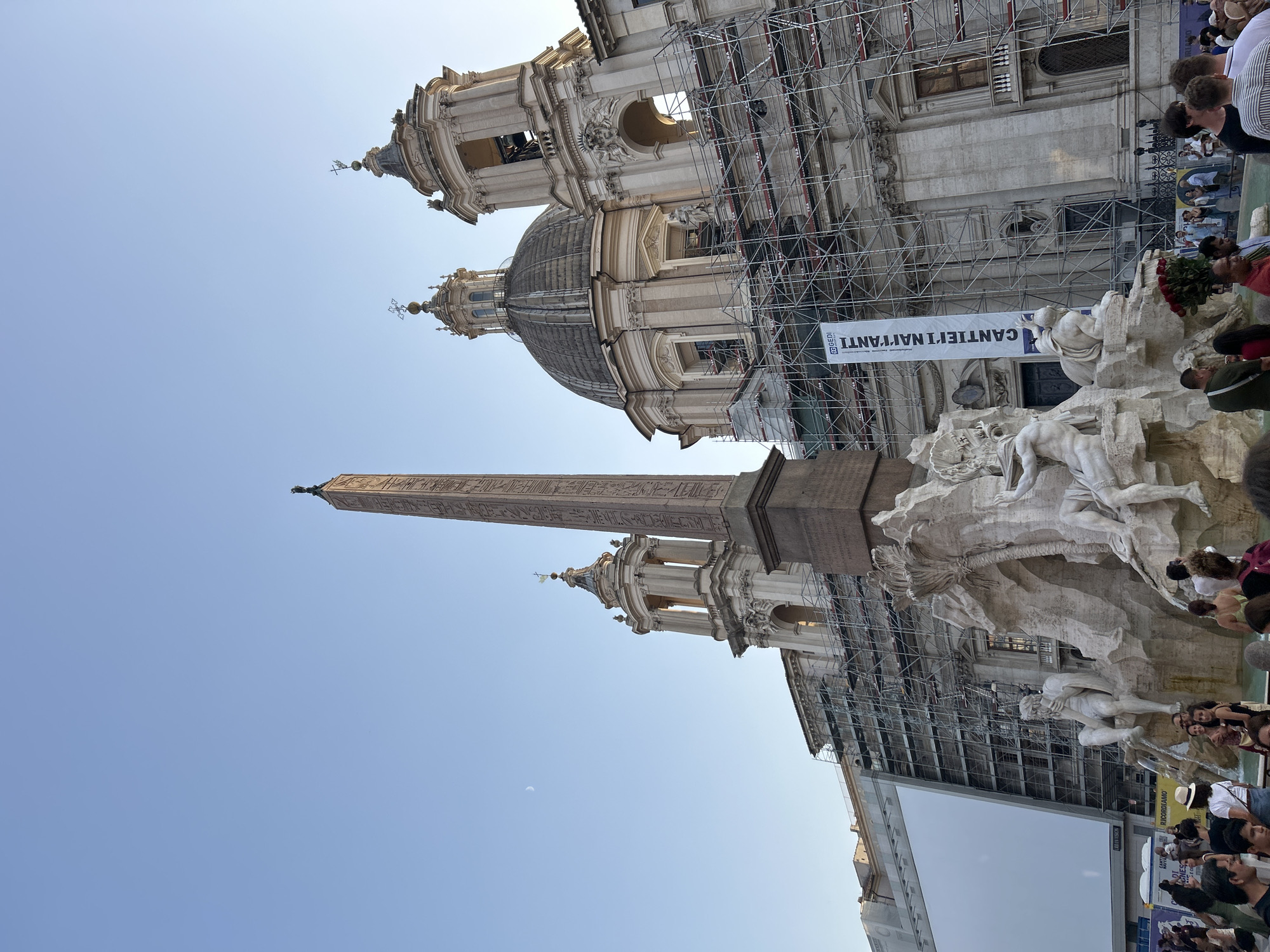 Piazza Navona's iconic fountain and obelisk on a sunny afternoon