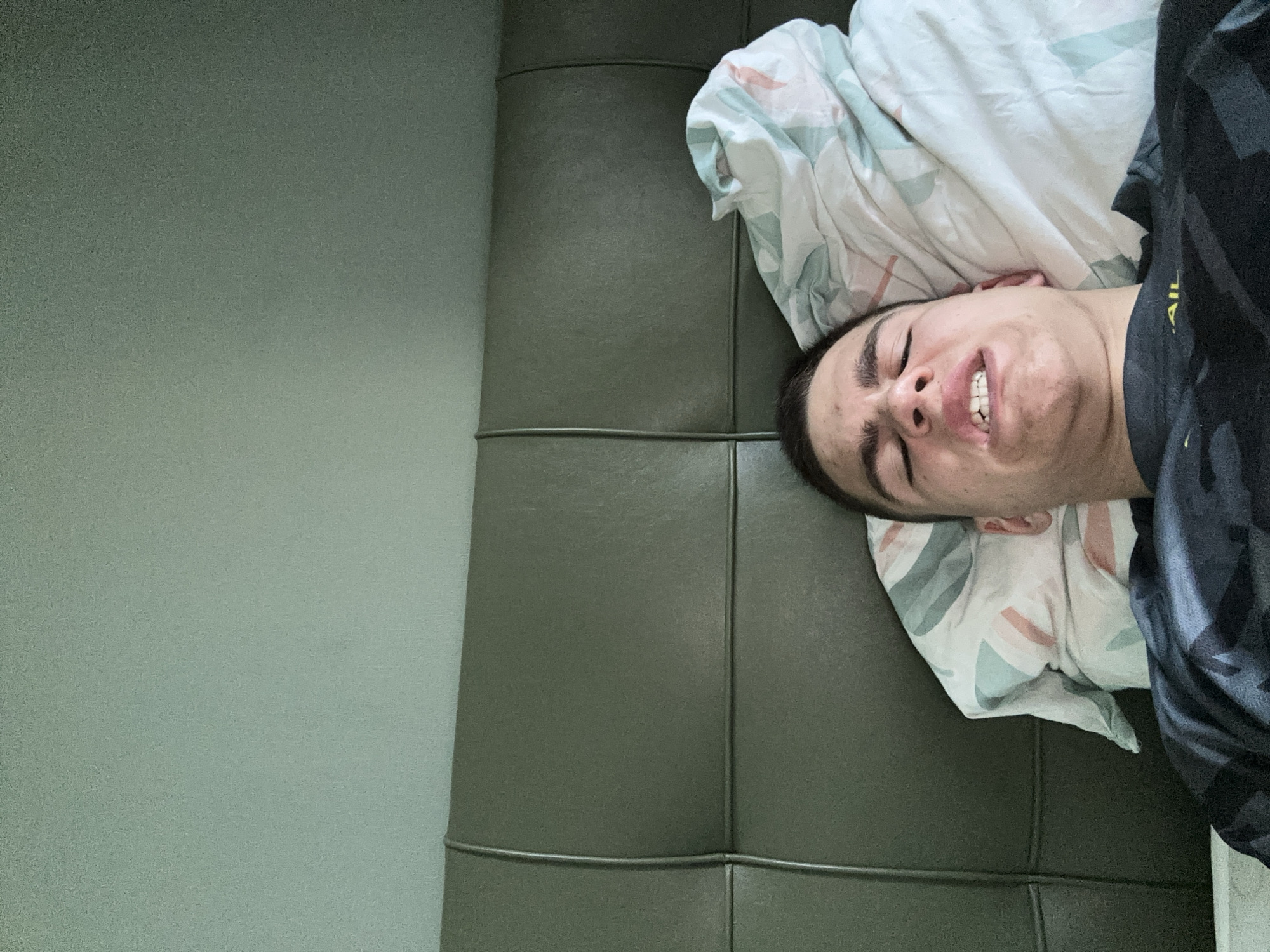 Young man resting in bedroom captured across multiple angles