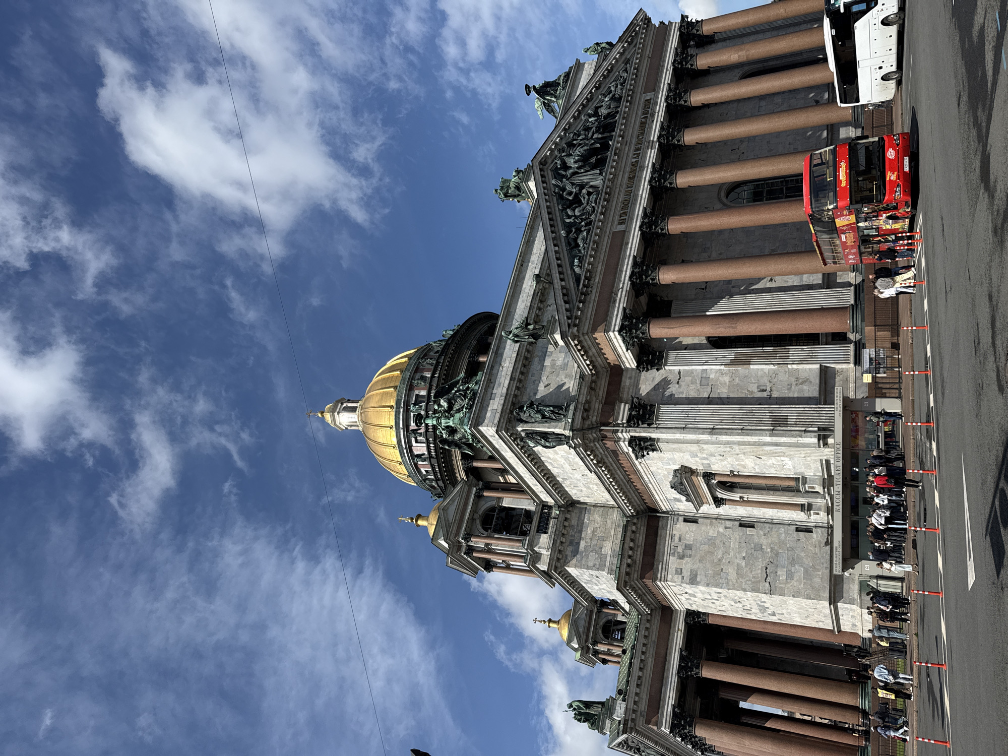 Saint Isaac's Cathedral facade under a blue summer sky