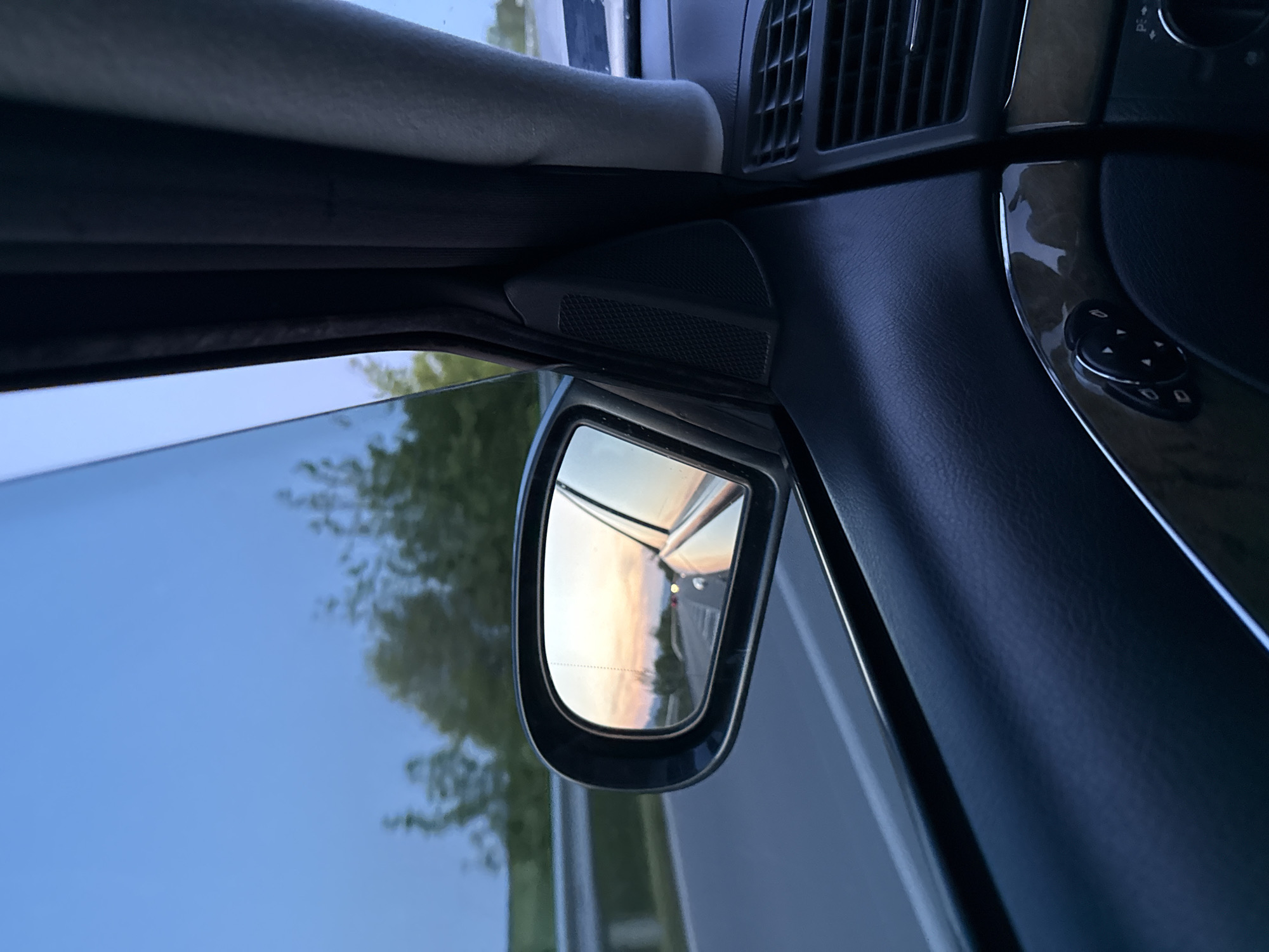Driver captures sunset road reflections in side mirror, Bulgaria