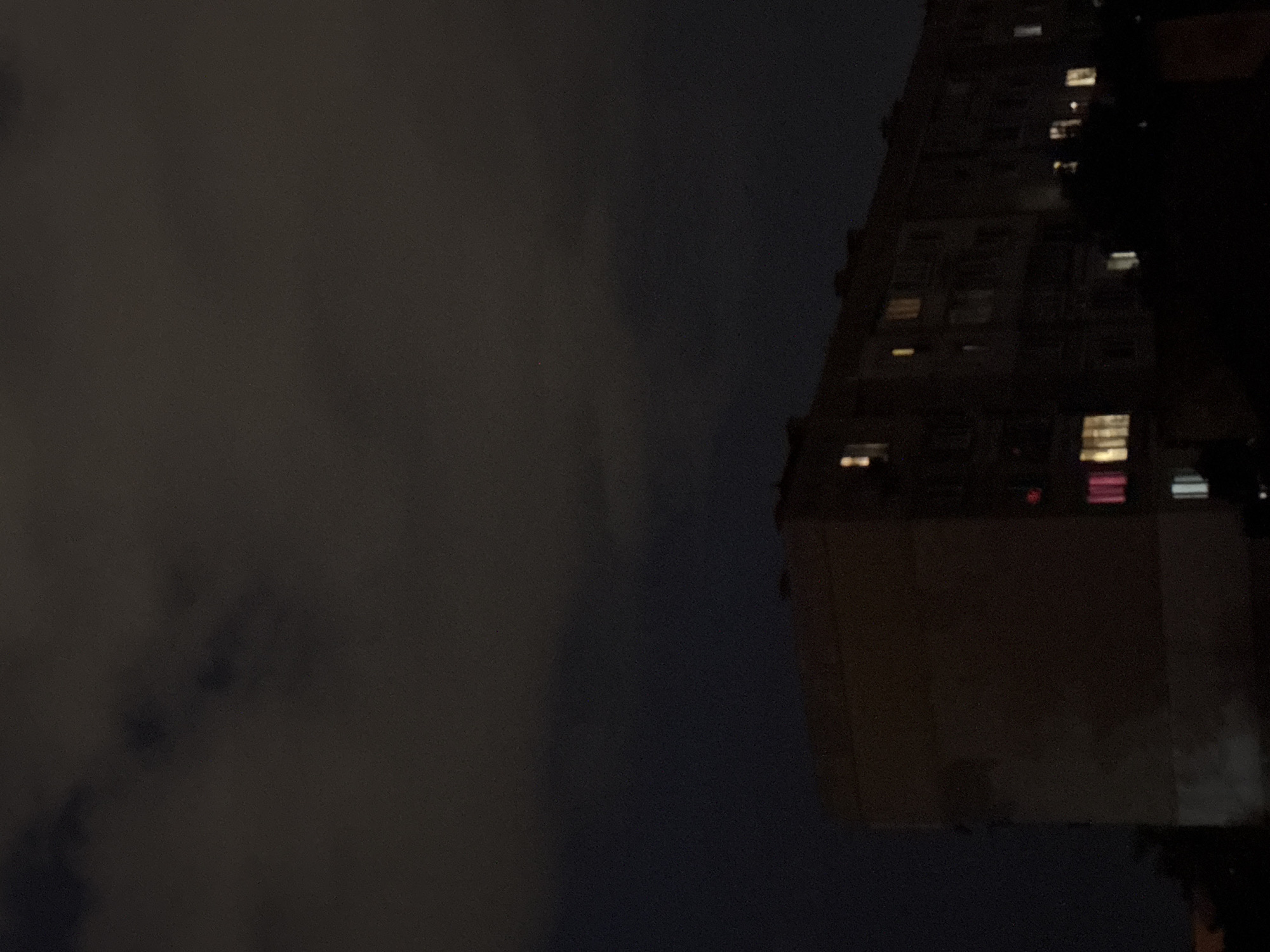 Brutalist apartment block at night in residential Sofia