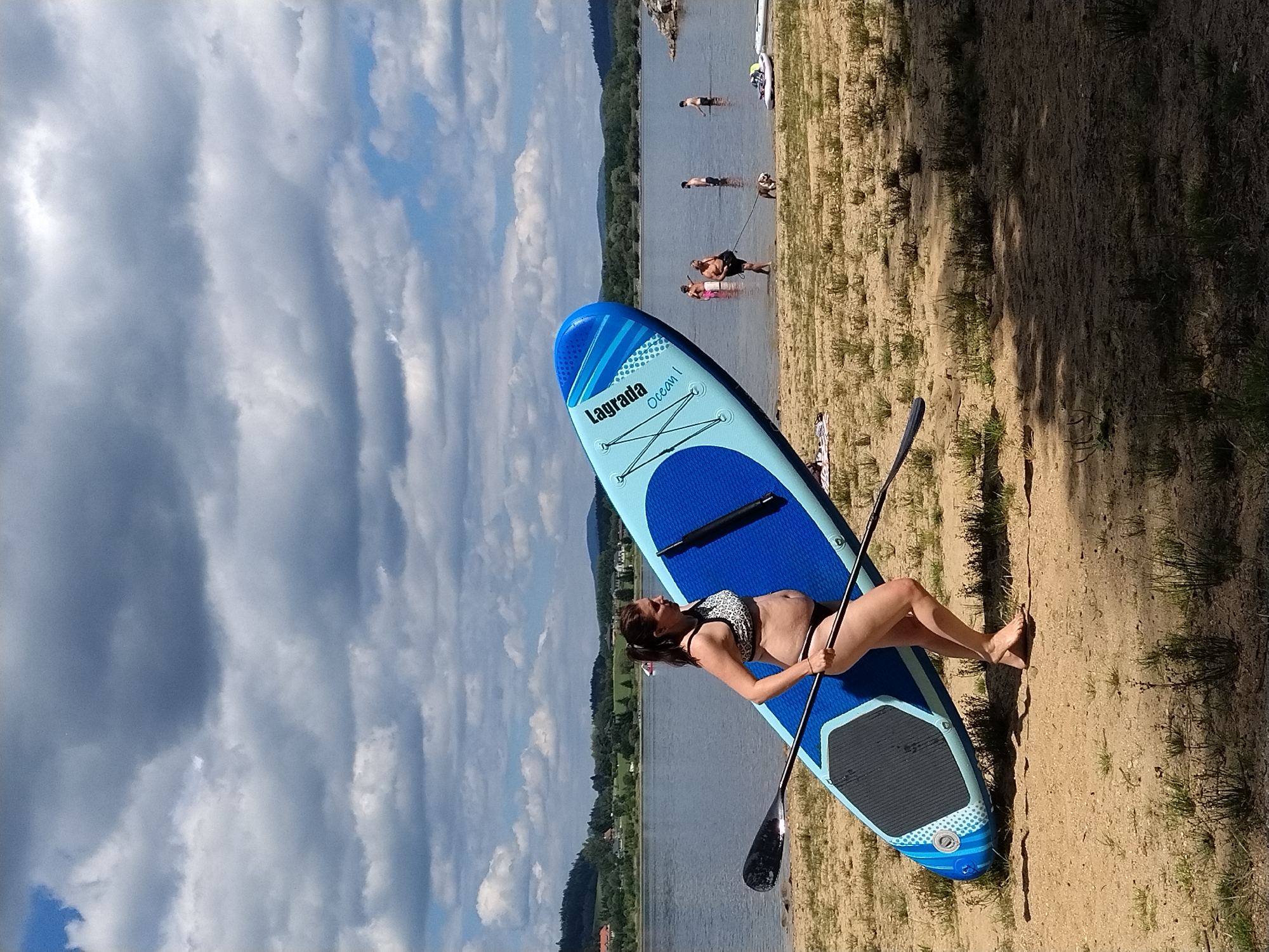 Summer day at Radslav Lake: beach, paddleboards, and easy living
