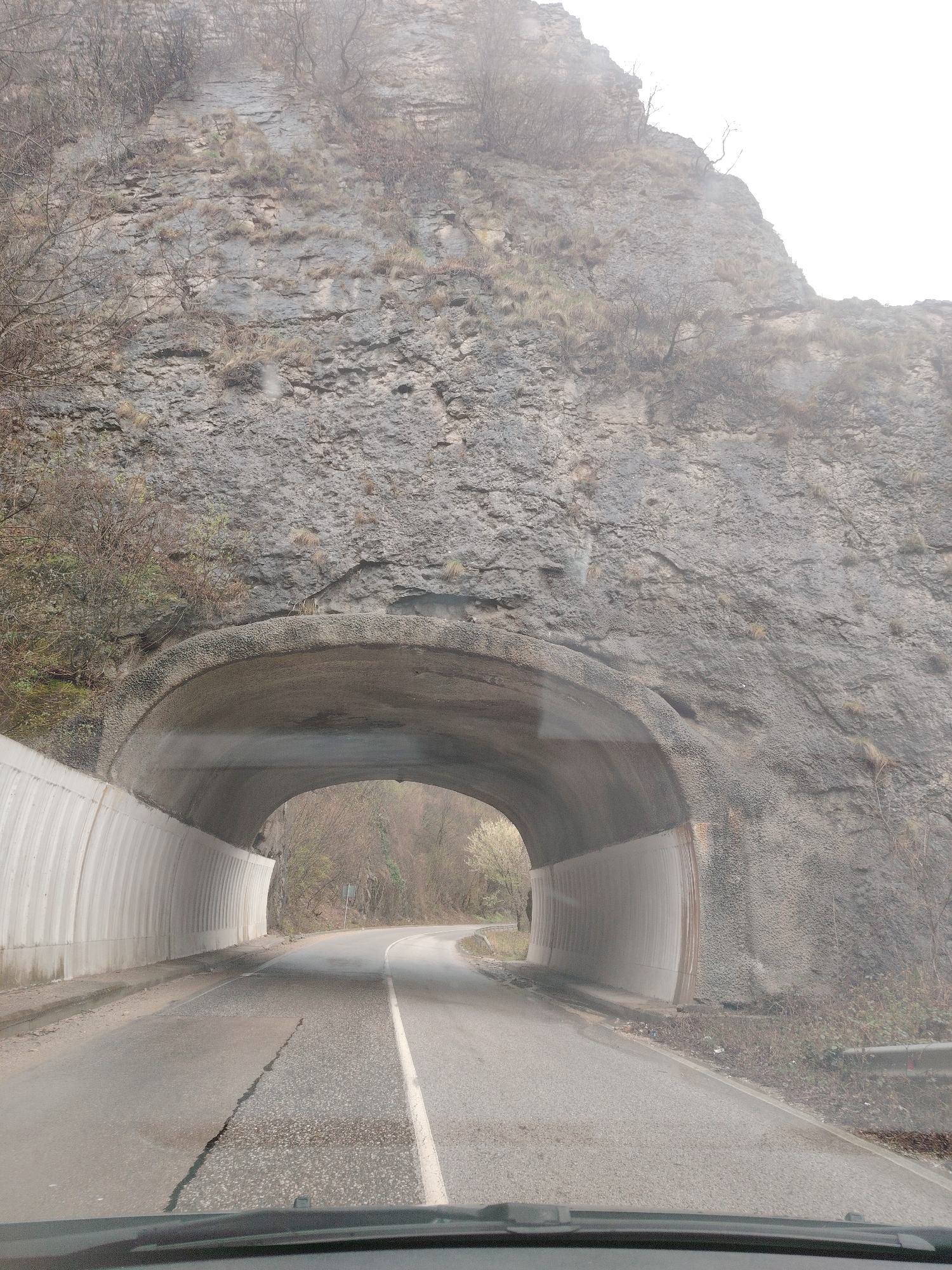 Vehicle passes through rock tunnel in Lyutibrod, Bulgaria