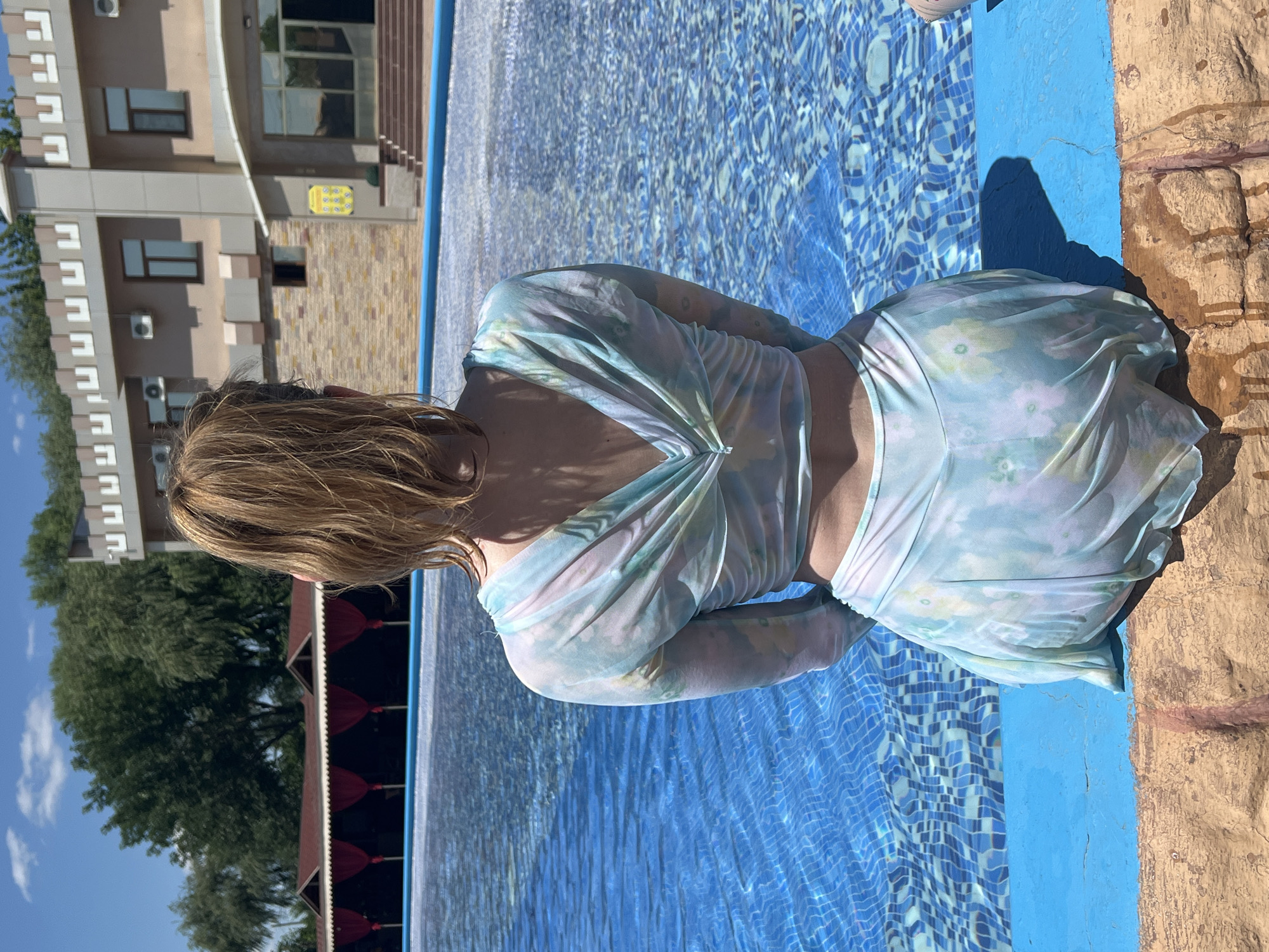 Poolside leisure at an outdoor resort in Shymkent